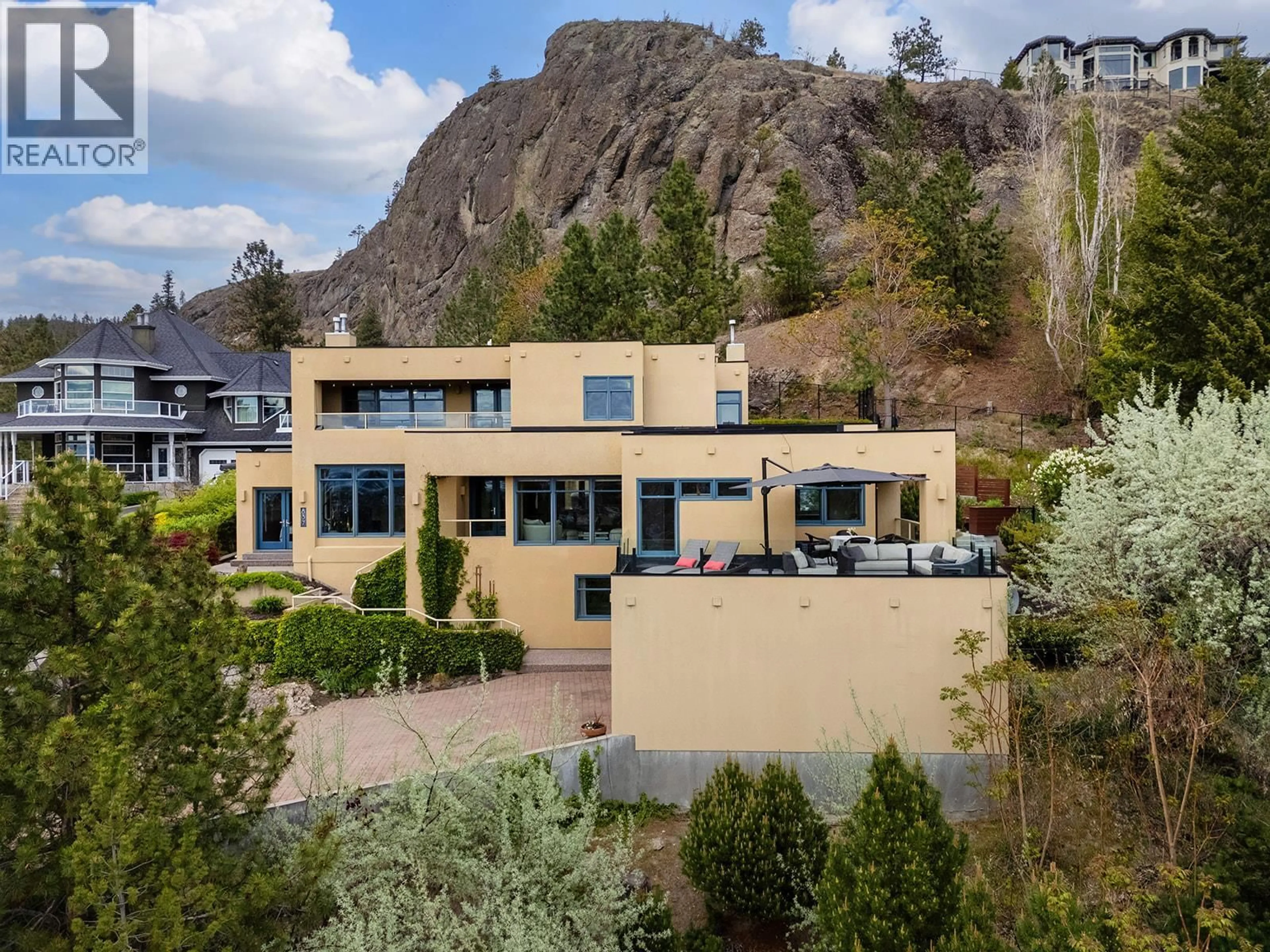 A pic from outside/outdoor area/front of a property/back of a property/a pic from drone, mountain view for 837 MOUNT ROYAL DRIVE, Kelowna British Columbia V1Y3M3