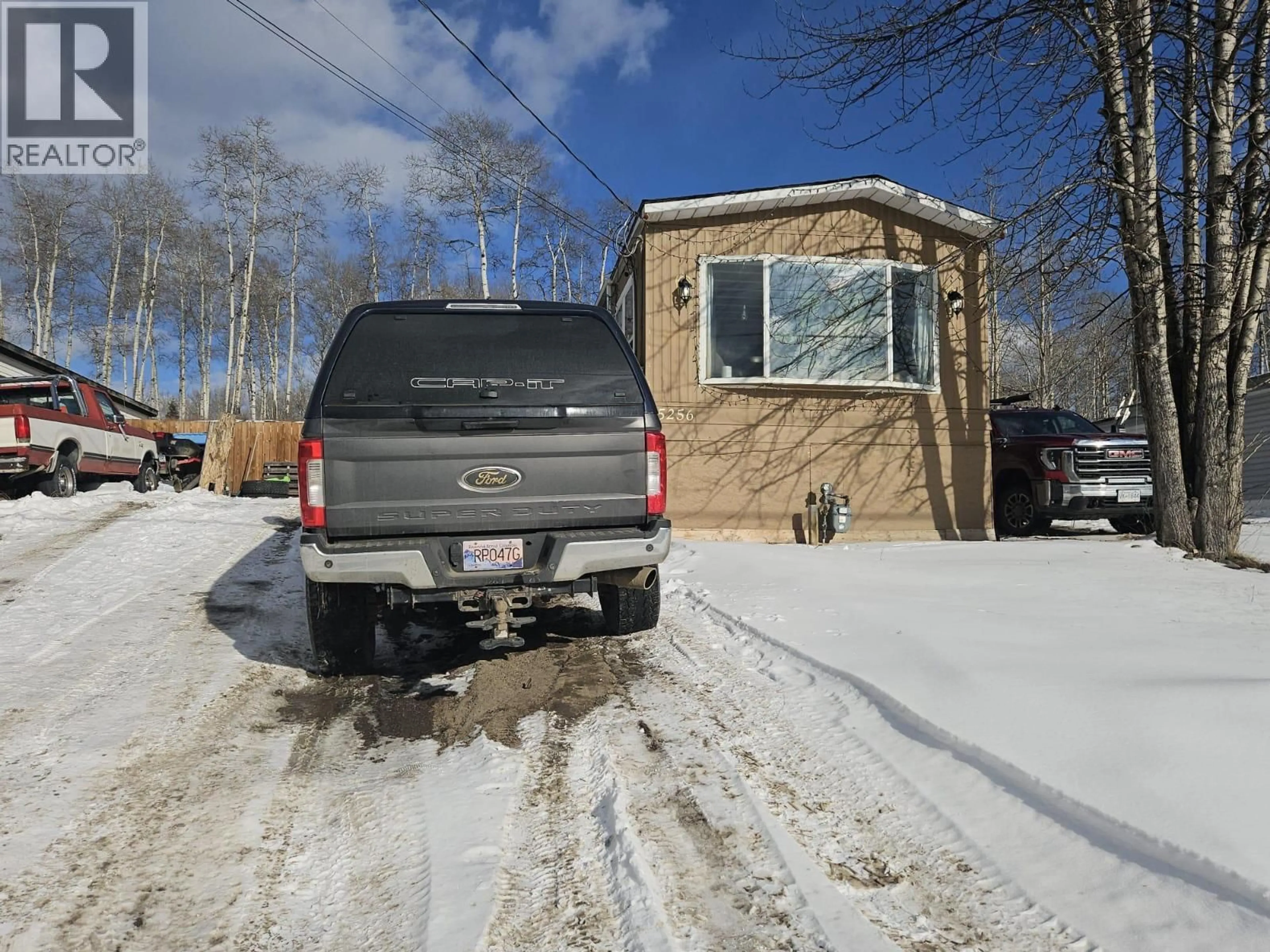 Home with vinyl exterior material, street for 5256 45 STREET SOUTHEAST, Chetwynd British Columbia V0C1J0