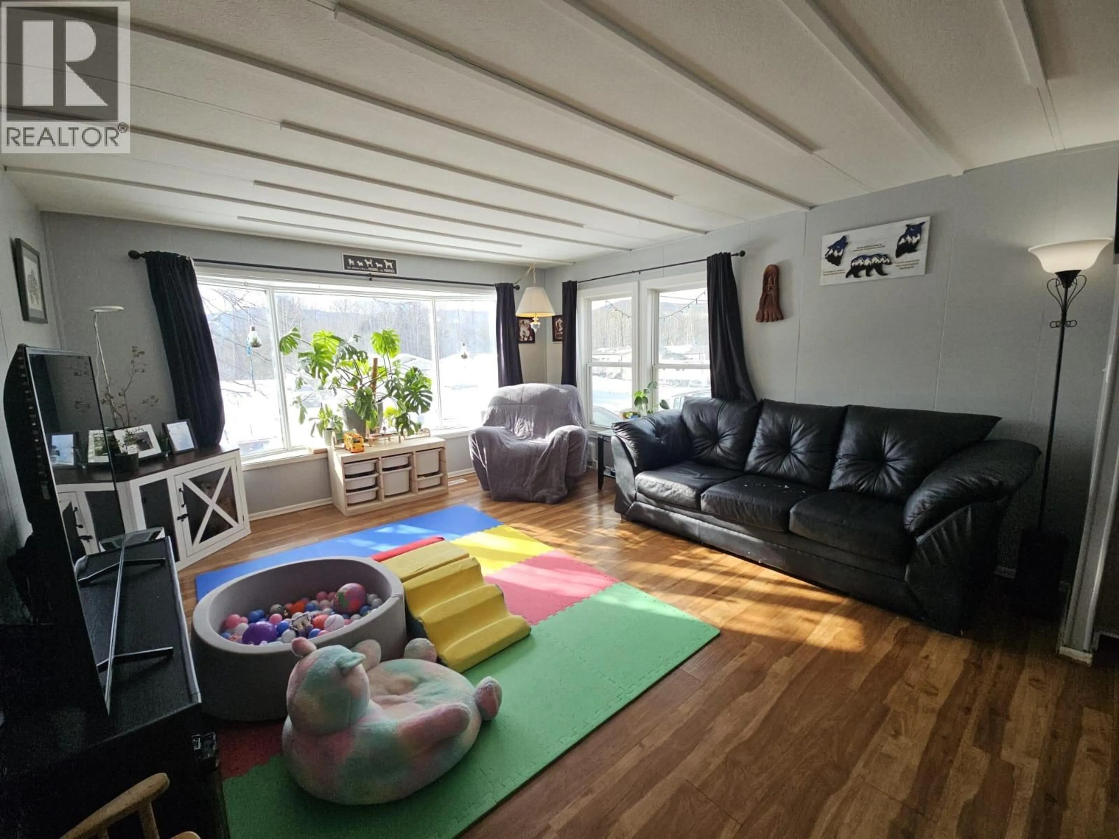 Living room with furniture, unknown for 5256 45 STREET SOUTHEAST, Chetwynd British Columbia V0C1J0