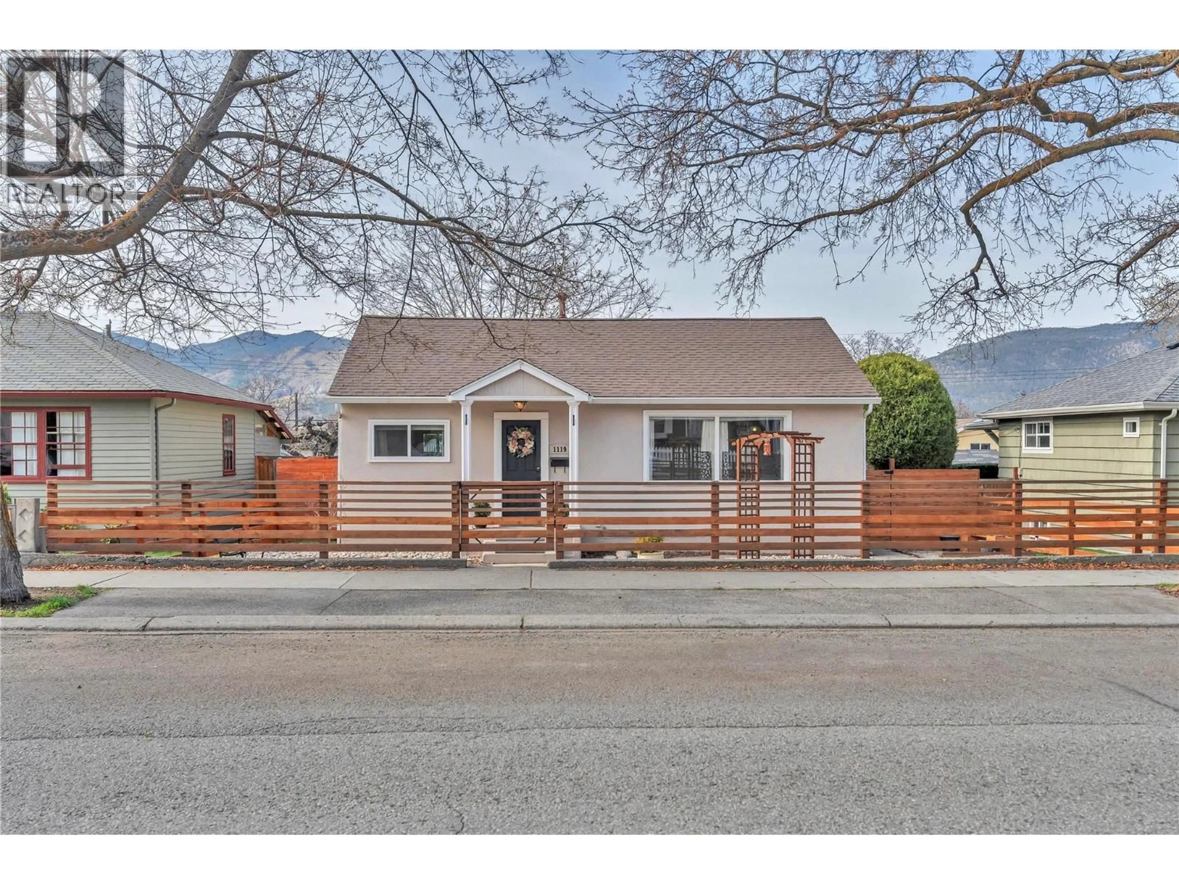 Home with vinyl exterior material, street for 1119 KILWINNING STREET, Penticton British Columbia V2A4N9