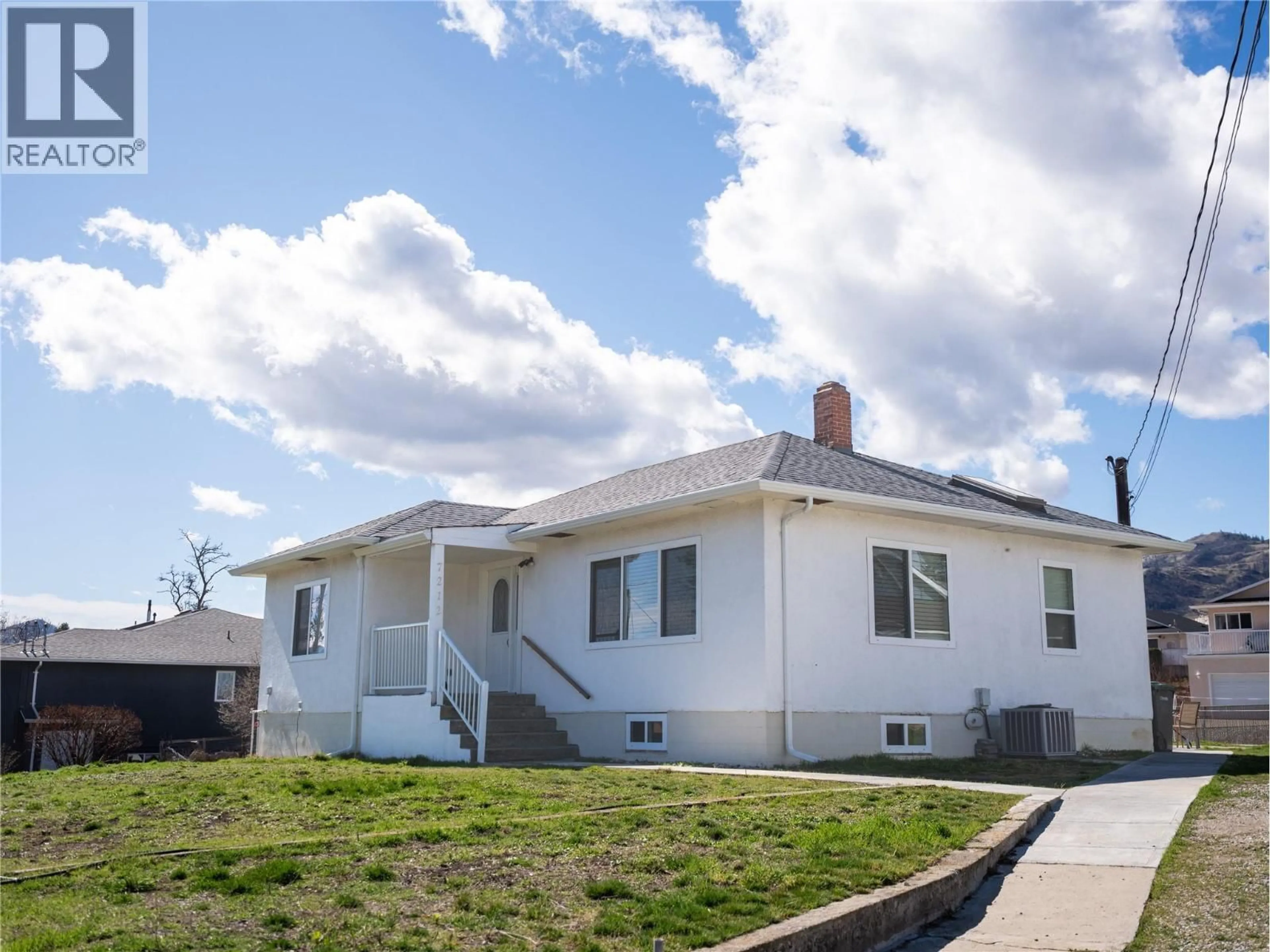 Home with vinyl exterior material, street for 7212 HERON LANE, Osoyoos British Columbia V0H1V0