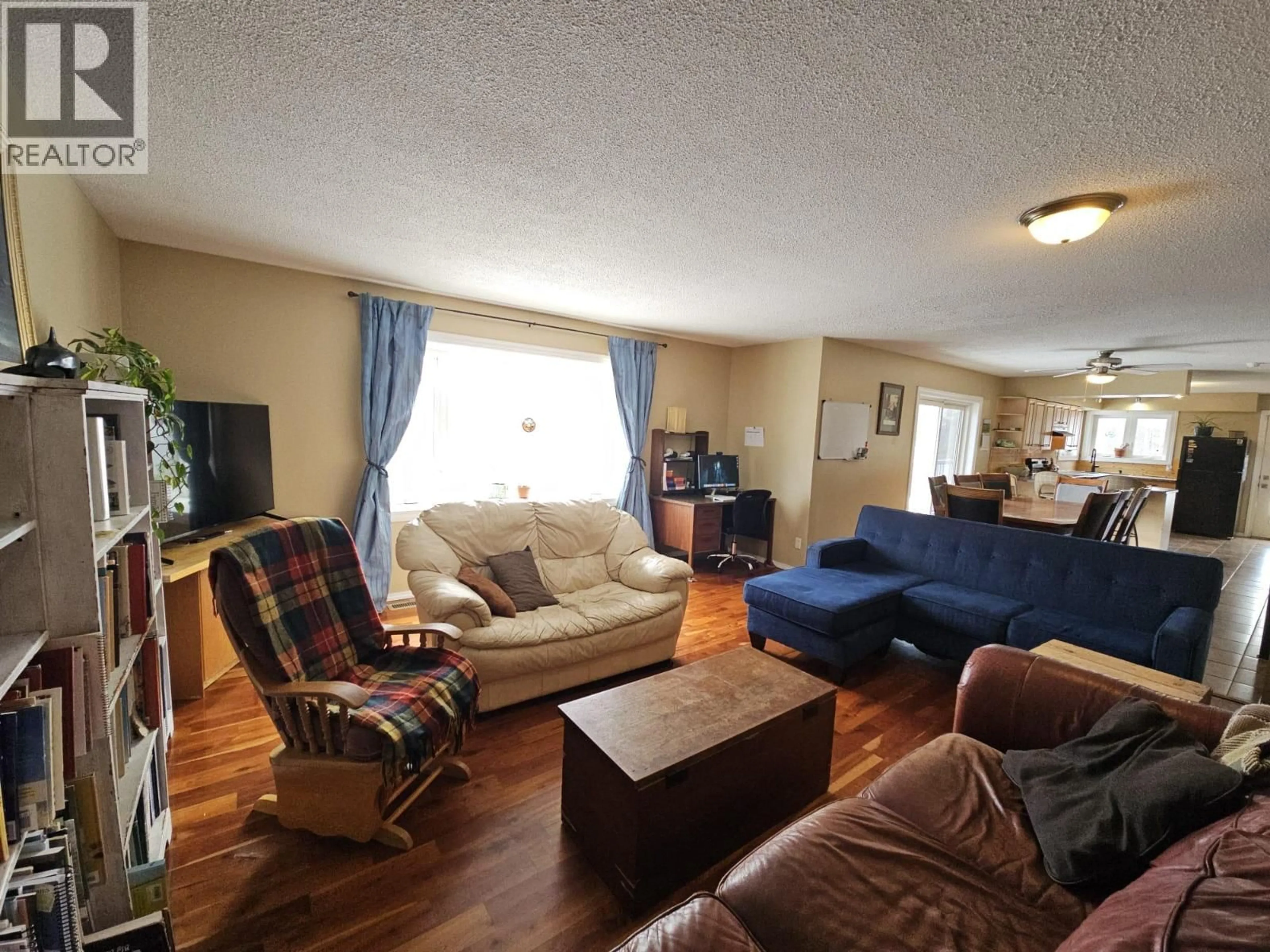 Living room with furniture, wood/laminate floor for 6128 KURJATA ROAD, Chetwynd British Columbia V0C1J0