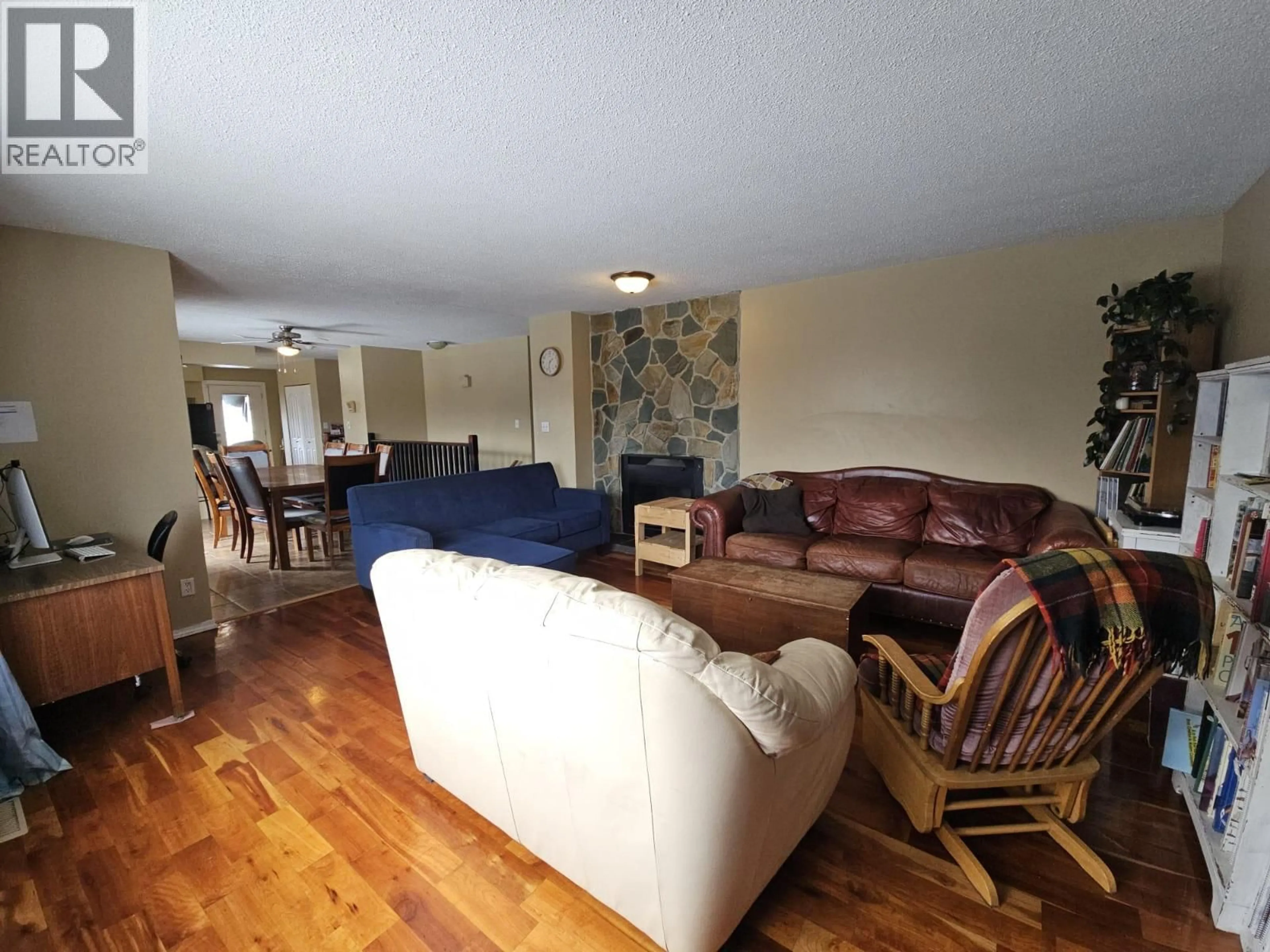 Living room with furniture, wood/laminate floor for 6128 KURJATA ROAD, Chetwynd British Columbia V0C1J0