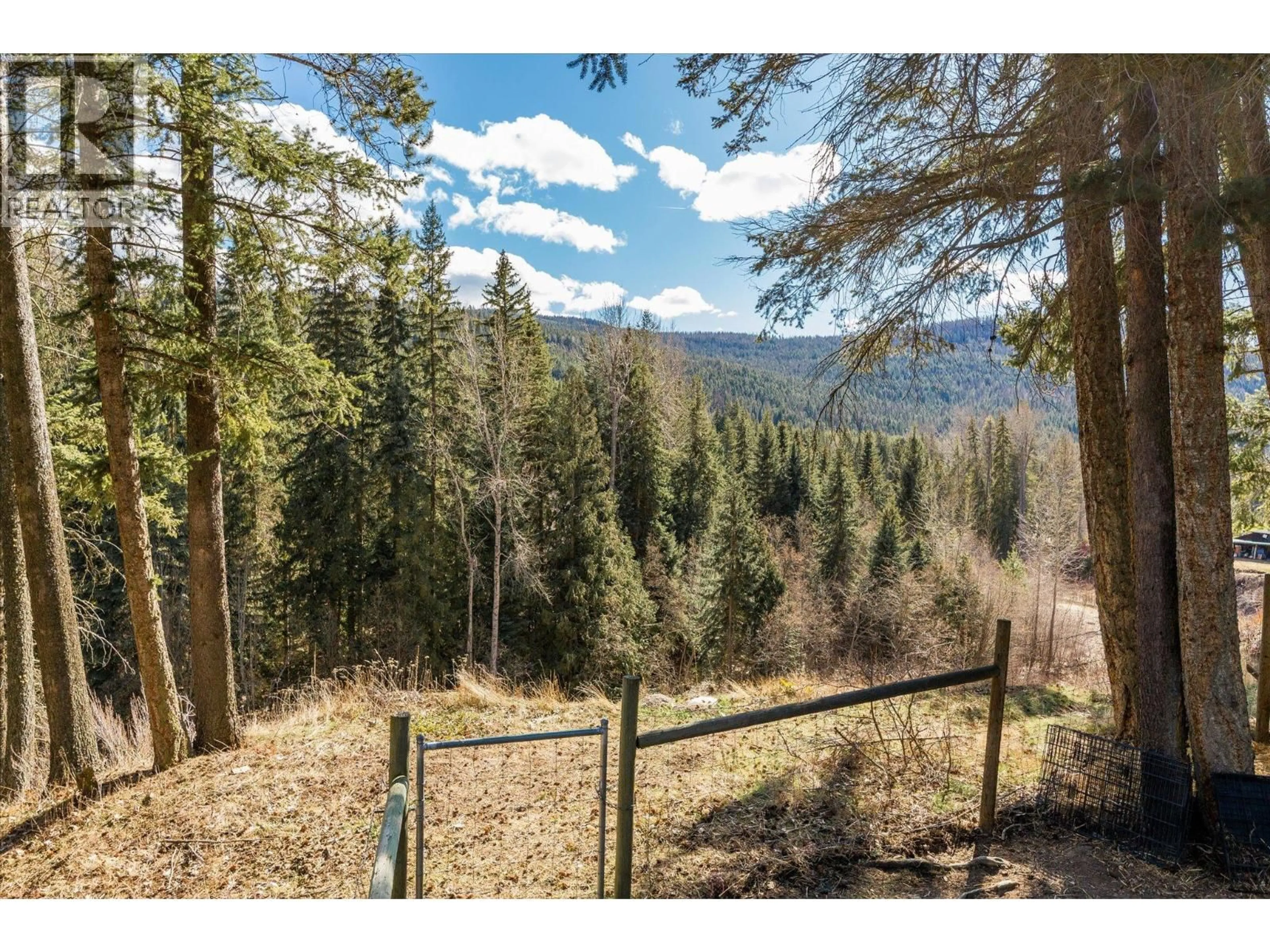 A pic from outside/outdoor area/front of a property/back of a property/a pic from drone, forest/trees view for 10623 HIGHWAY 33 EAST HIGHWAY, Kelowna British Columbia V1Y1J9