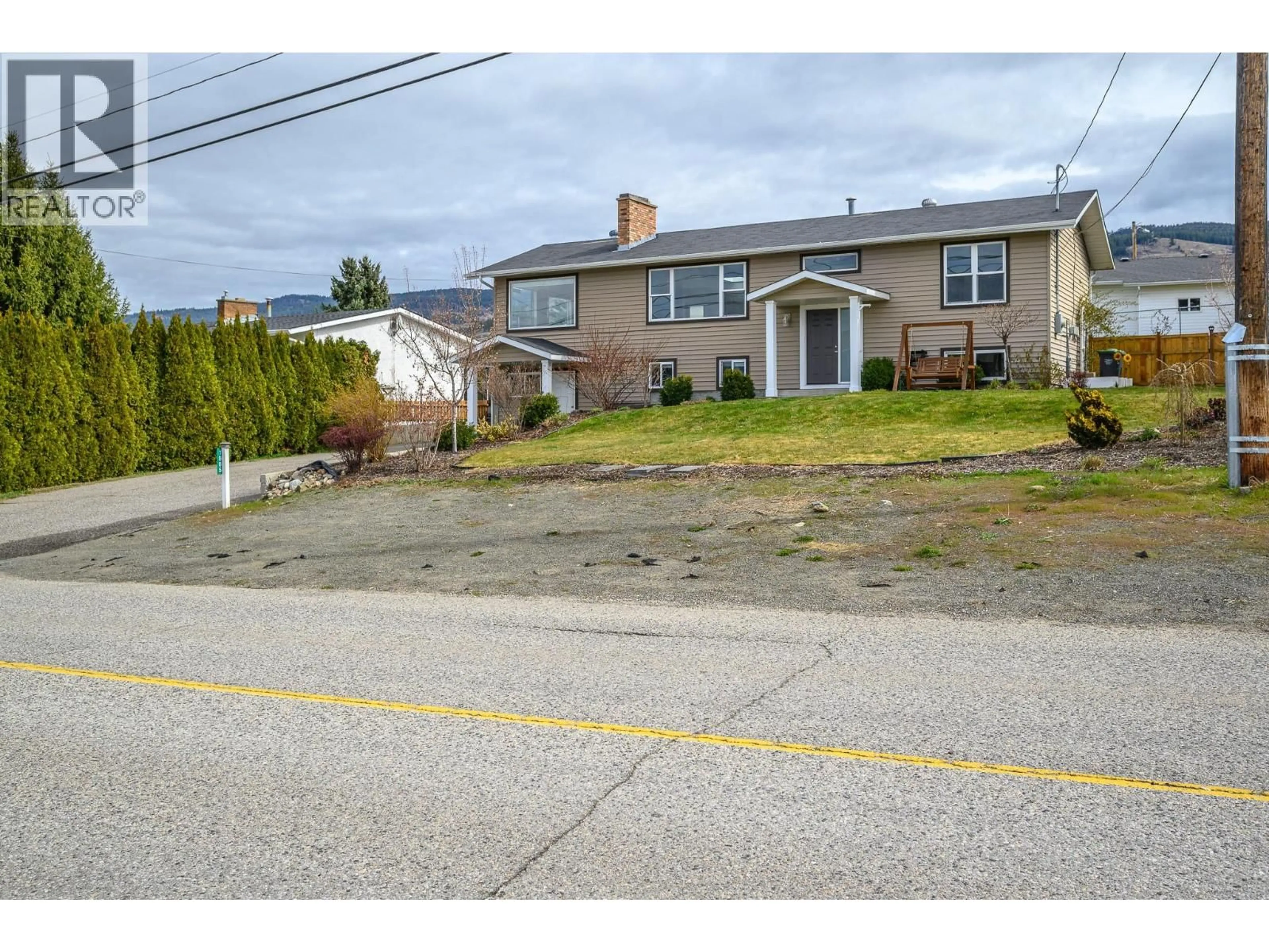 A pic from outside/outdoor area/front of a property/back of a property/a pic from drone, street for 1885 MCKENZIE ROAD, Kelowna British Columbia V1P1A8