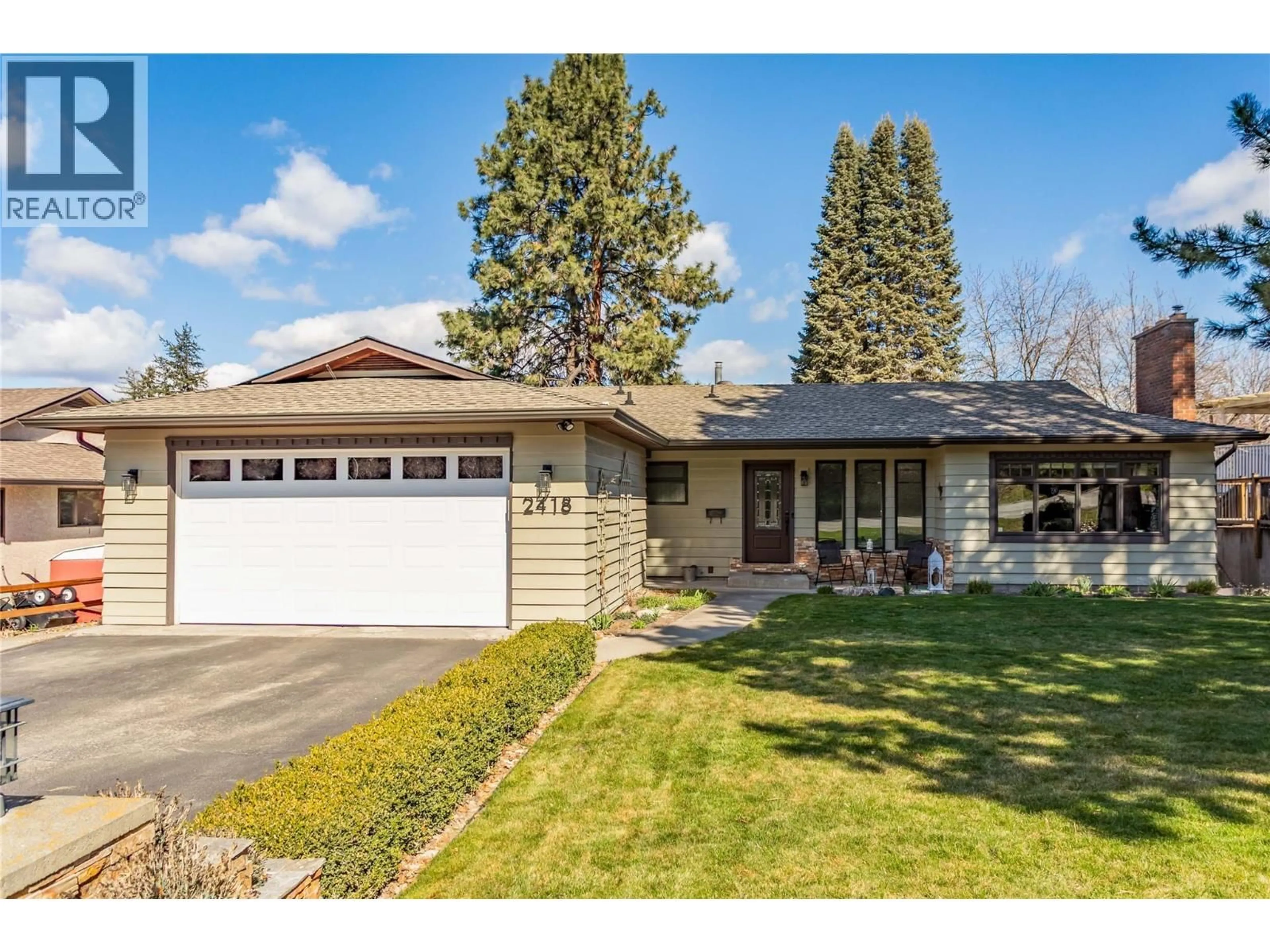 Home with vinyl exterior material, street for 2418 FAIRHALL ROAD, Kelowna British Columbia V1W2W2