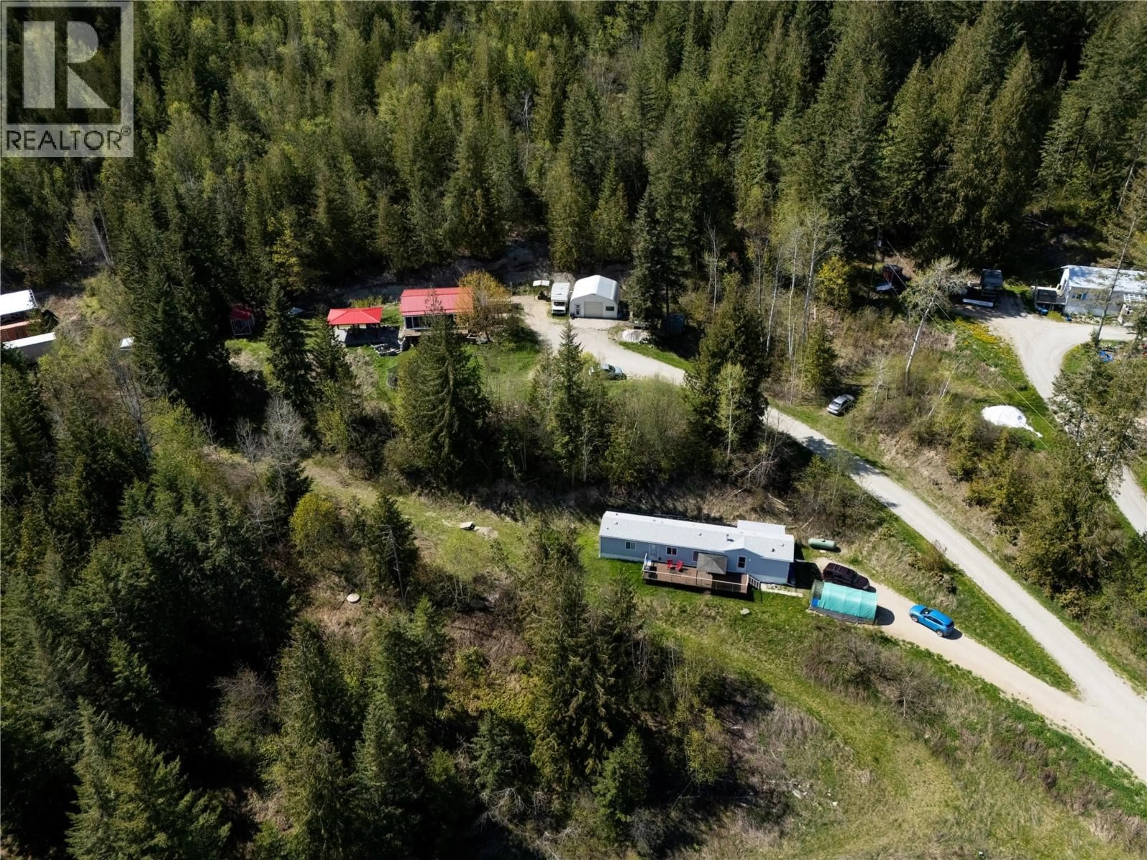 A pic from outside/outdoor area/front of a property/back of a property/a pic from drone, forest/trees view for 6740 HIGHWAY 97A HIGHWAY, Grindrod British Columbia V0E1Y0
