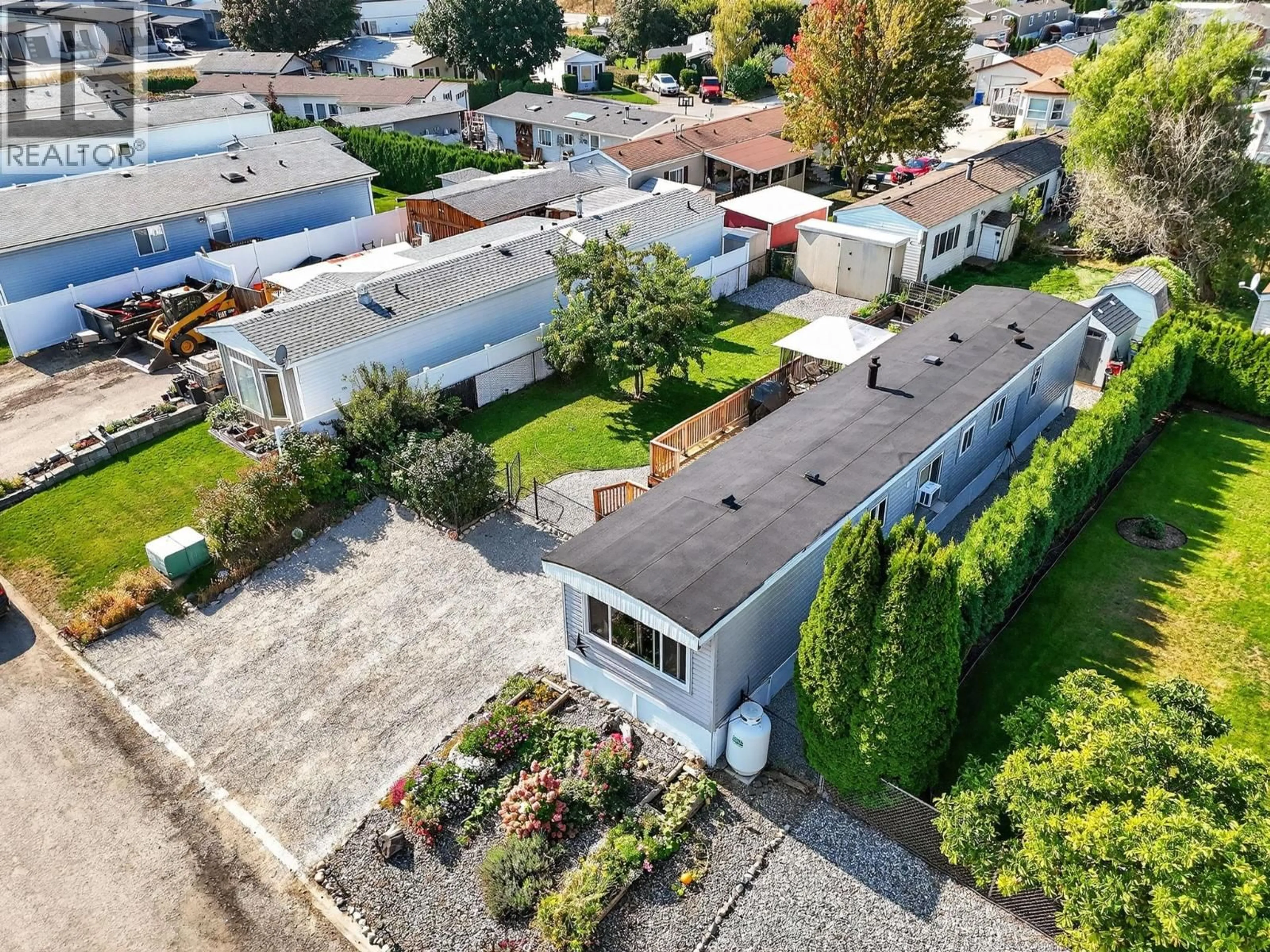 A pic from outside/outdoor area/front of a property/back of a property/a pic from drone, street for 34 - 8945 HWY 97N OTHER, Kelowna British Columbia V4V1E8