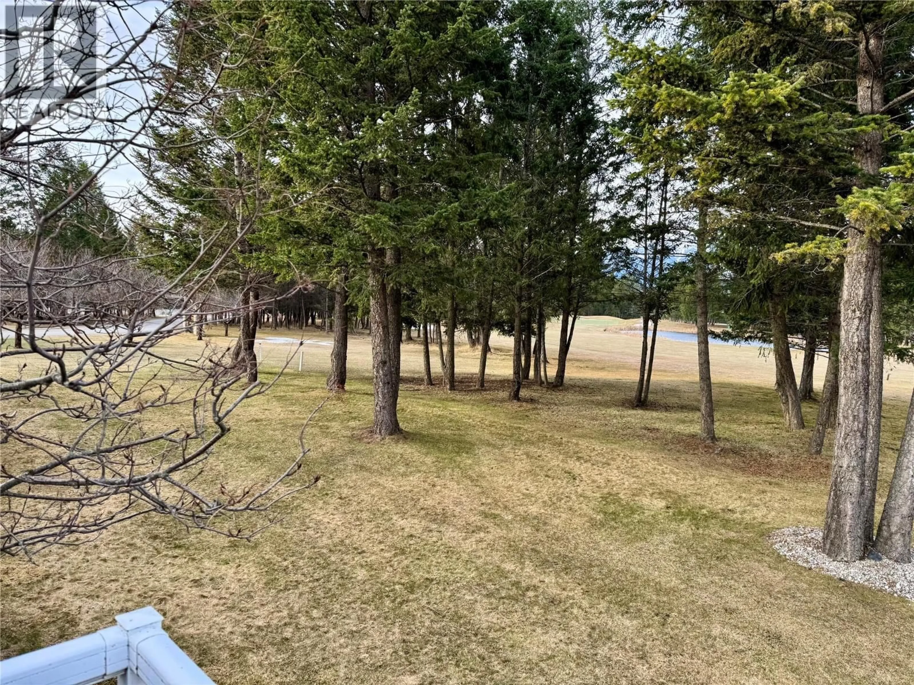 A pic from outside/outdoor area/front of a property/back of a property/a pic from drone, forest/trees view for 4 - 7559 COLUMBIA AVENUE, Radium Hot Springs British Columbia V0A1M0