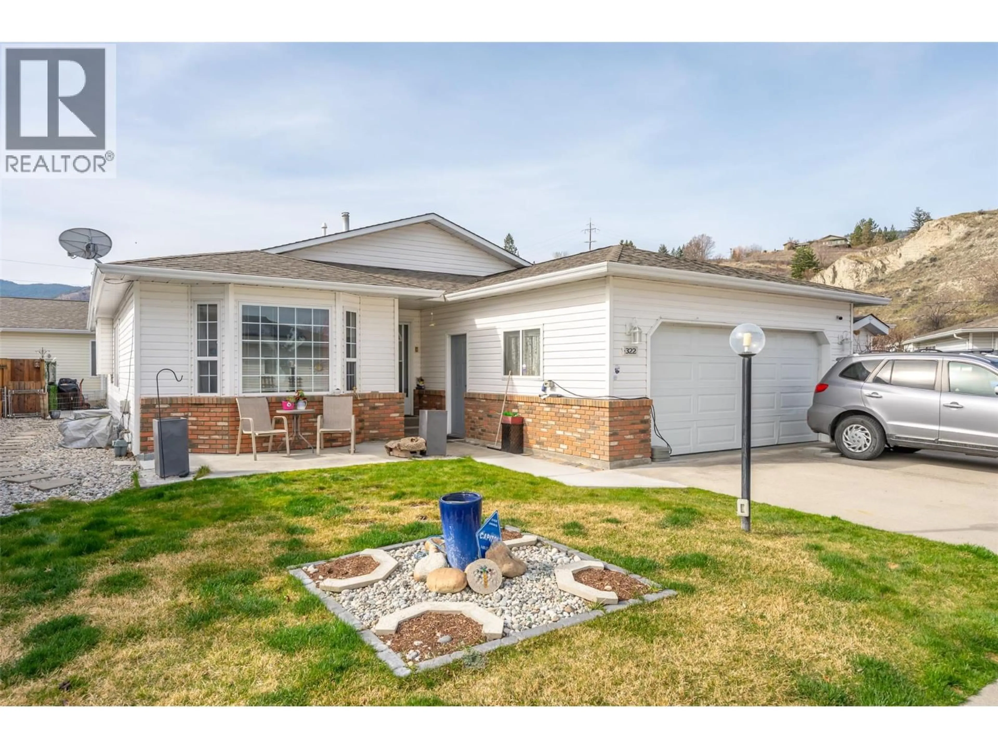 Home with vinyl exterior material, street for 322 FALCON DRIVE, Penticton British Columbia V2A8K6