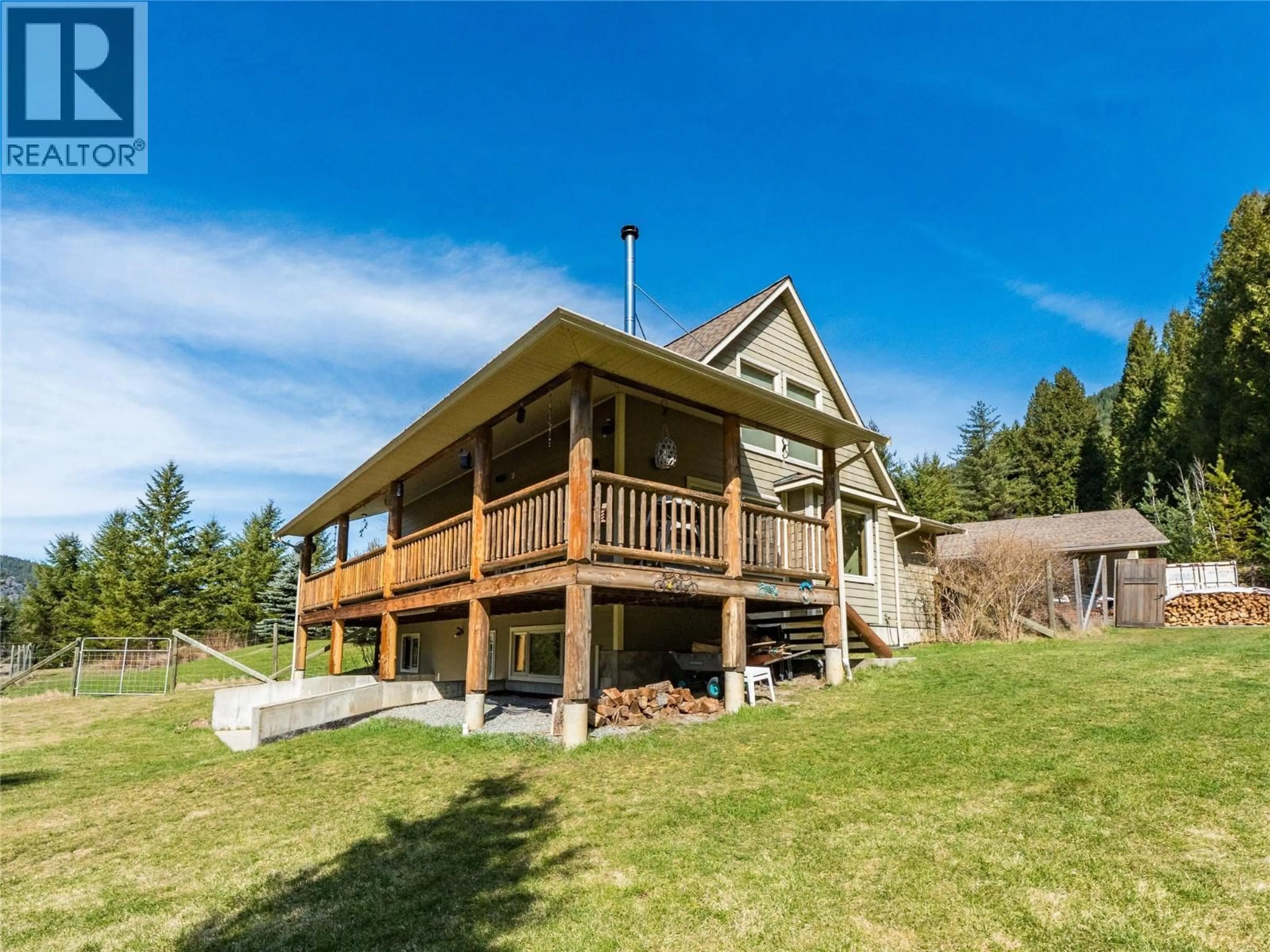 A pic from outside/outdoor area/front of a property/back of a property/a pic from drone, water/lake/river/ocean view for 955 CEDAR BRAE ROAD, Castlegar British Columbia V1N4R5
