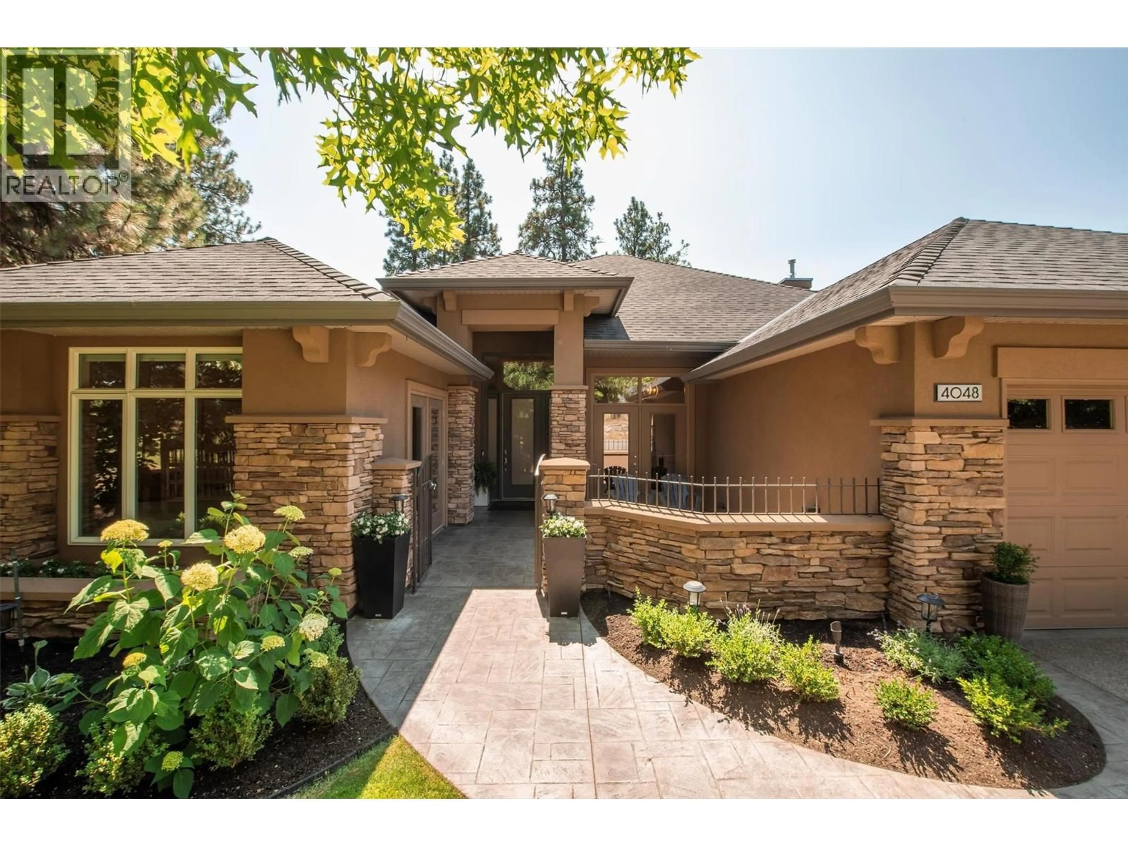Home with brick exterior material, unknown for 4048 GALLAGHERS TERRACE, Kelowna British Columbia V1W3Z8