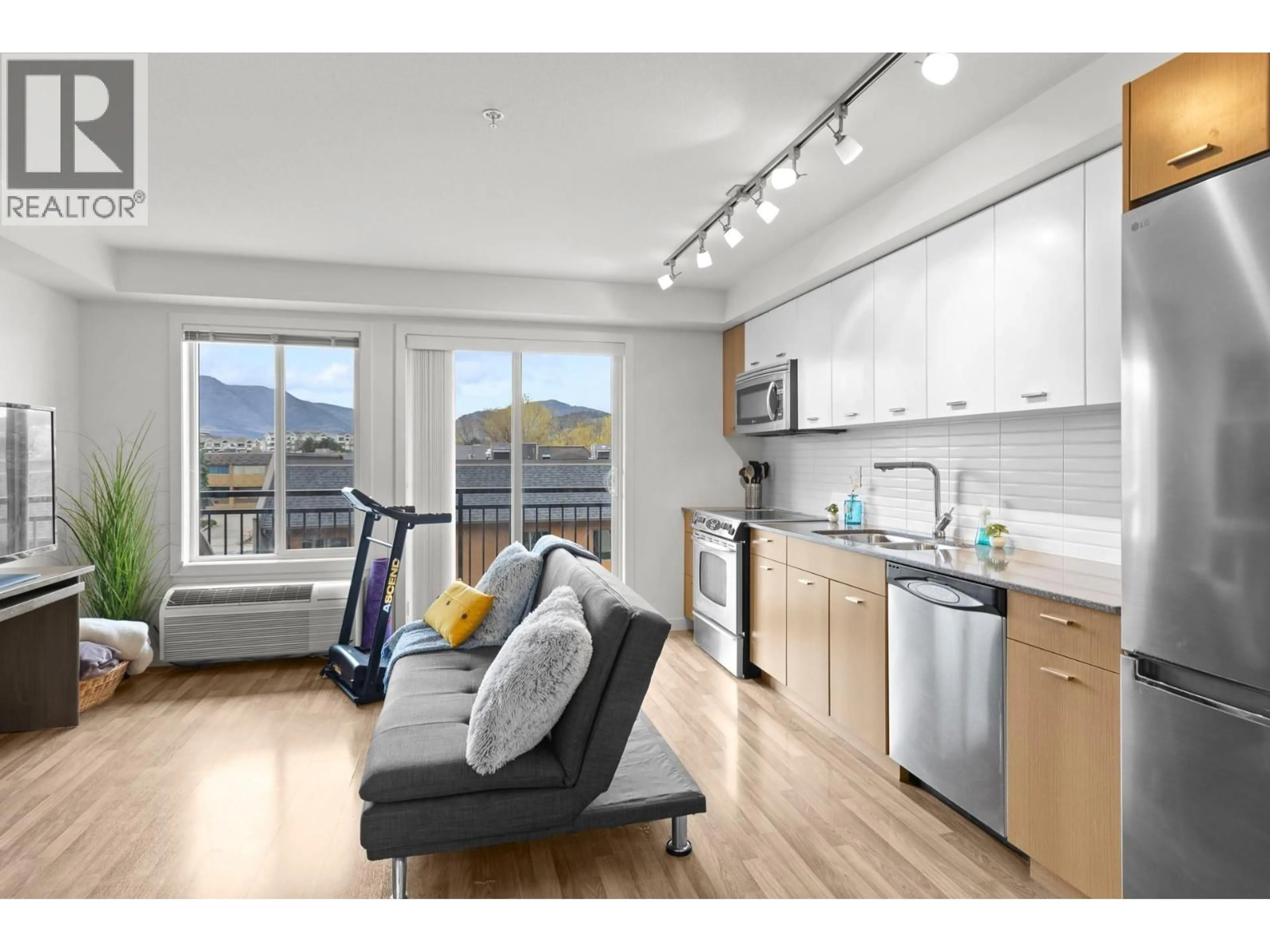 Open concept kitchen, wood/laminate floor for 316 - 1550 DICKSON AVENUE, Kelowna British Columbia V1Y9Y8