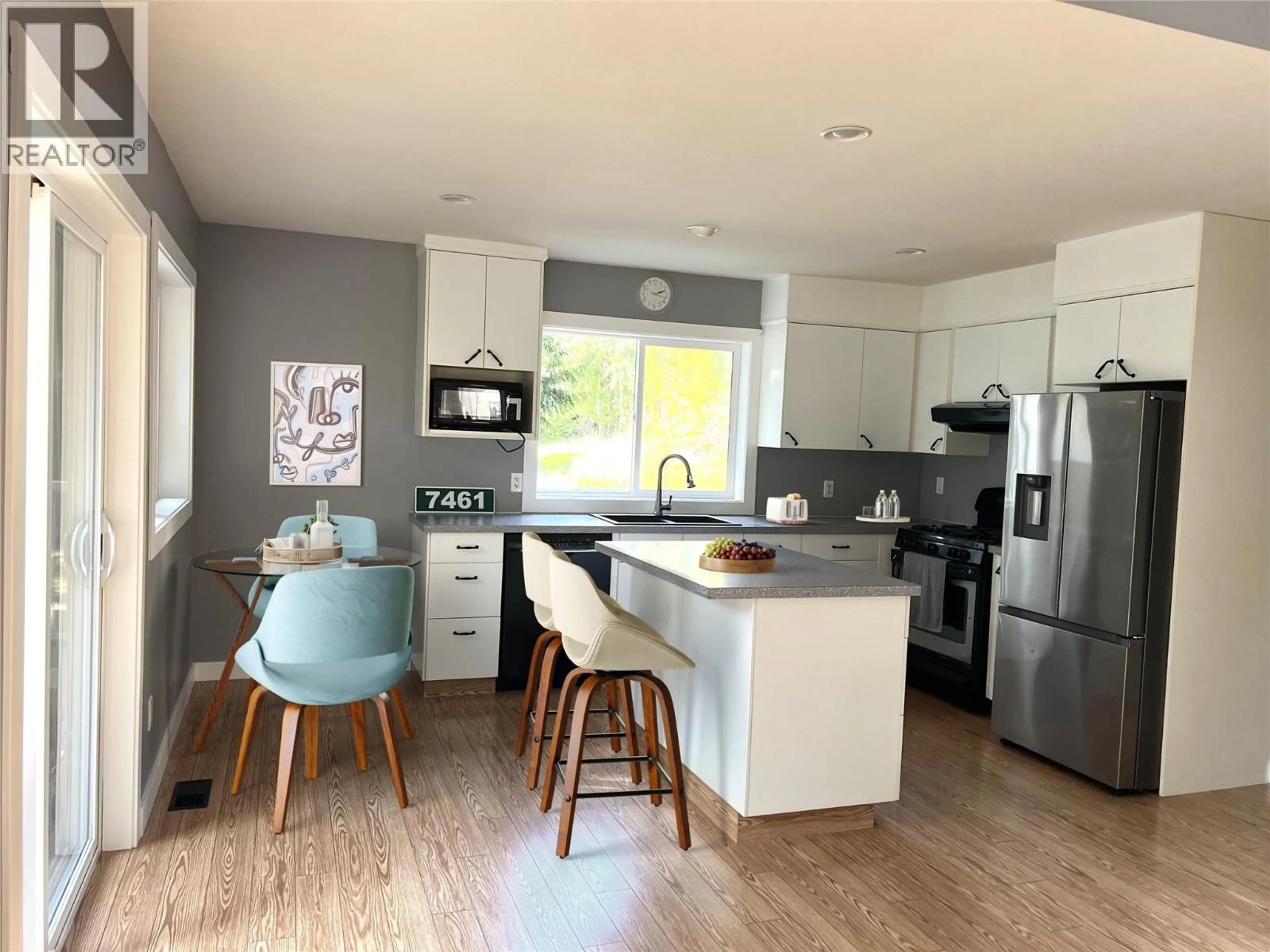 Open concept kitchen, wood/laminate floor for 7461 STAMPEDE TRAIL, Anglemont British Columbia V0E1M8