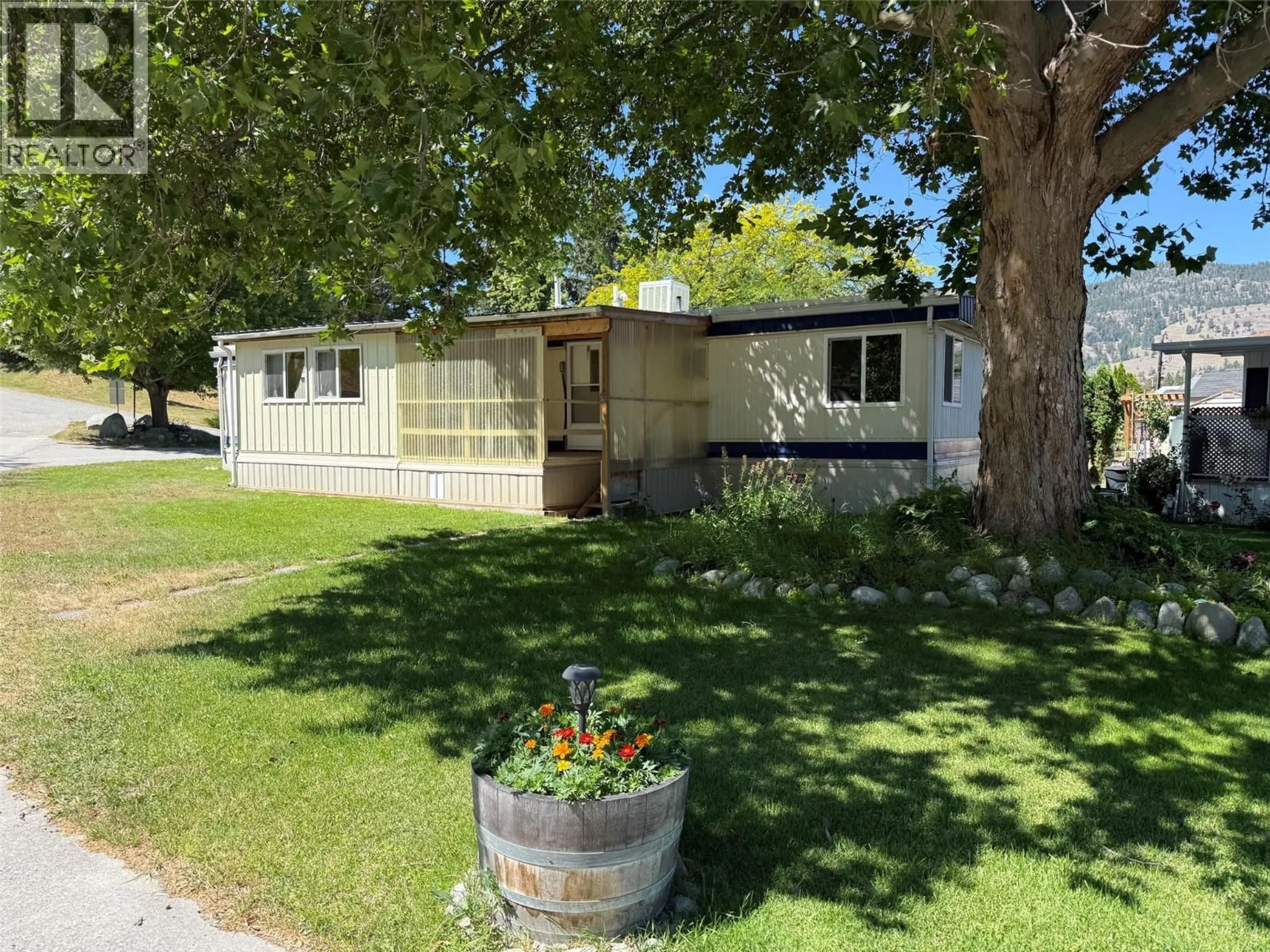A pic from outside/outdoor area/front of a property/back of a property/a pic from drone, street for 56 - 8712 STEUART STREET, Summerland British Columbia V0H1Z1