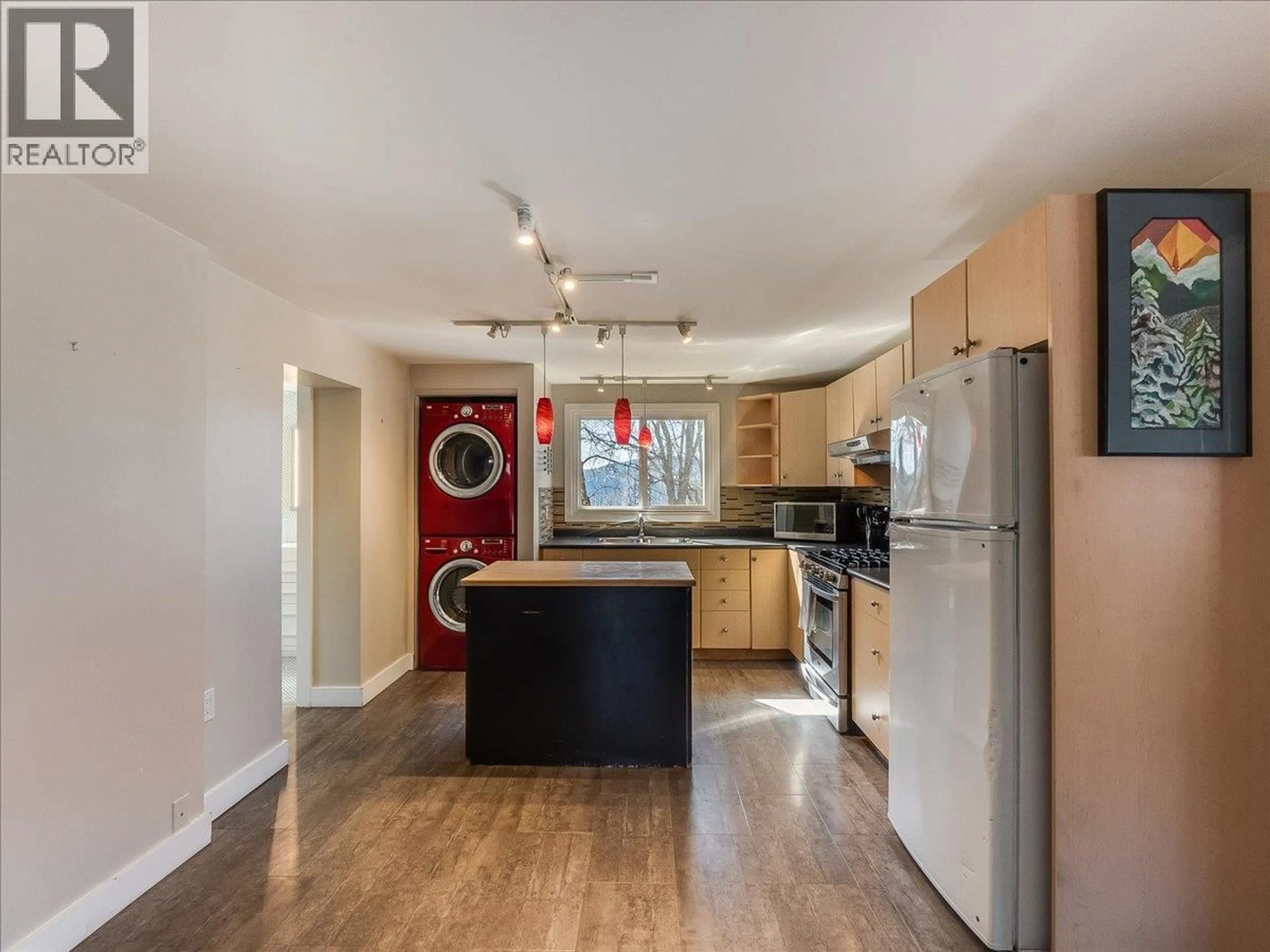 Open concept kitchen, wood/laminate floor for 2243 FIRST AVENUE, Rossland British Columbia V0G1Y0