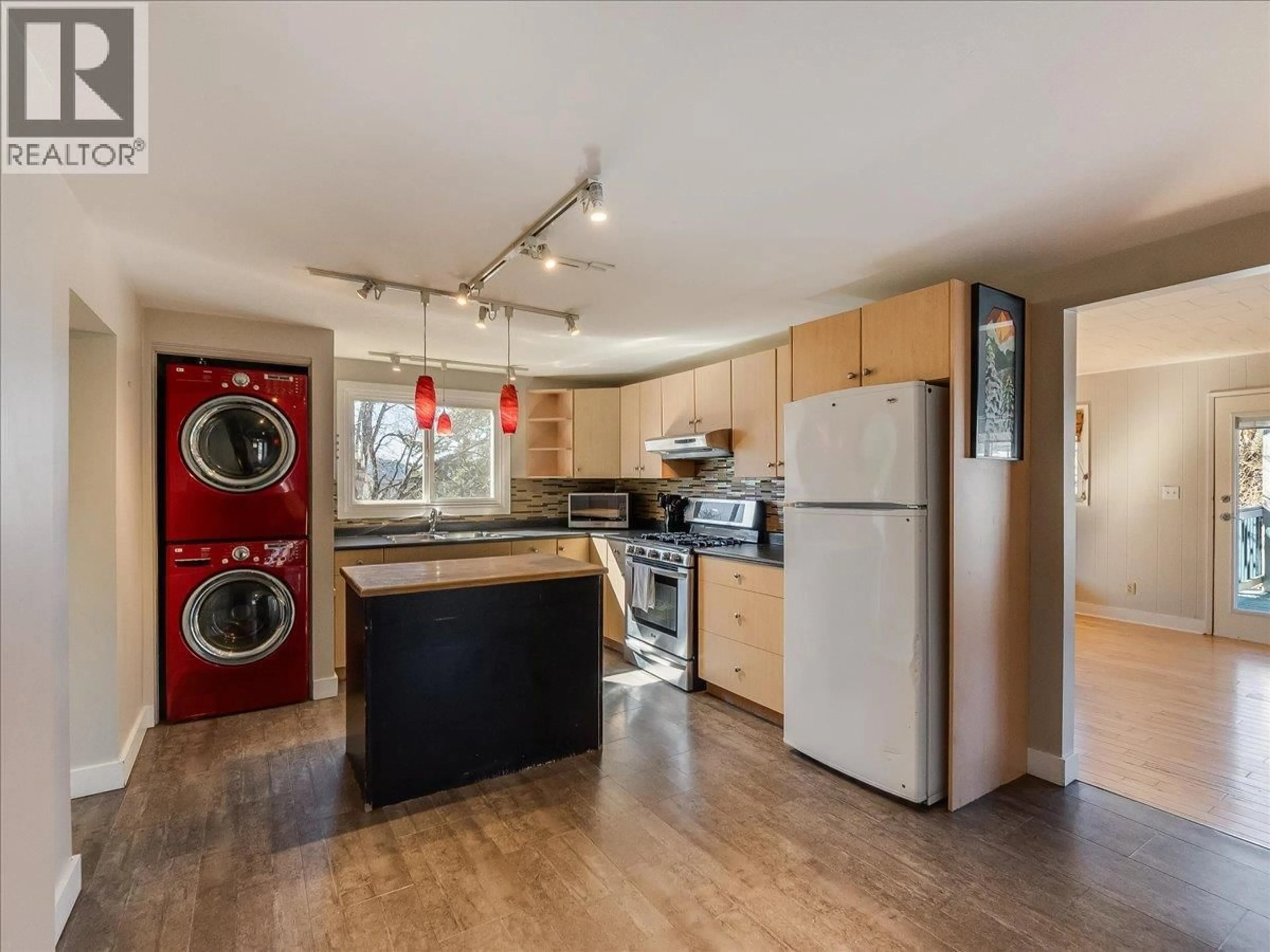 Kitchen with laundary machines, wood/laminate floor for 2243 FIRST AVENUE, Rossland British Columbia V0G1Y0