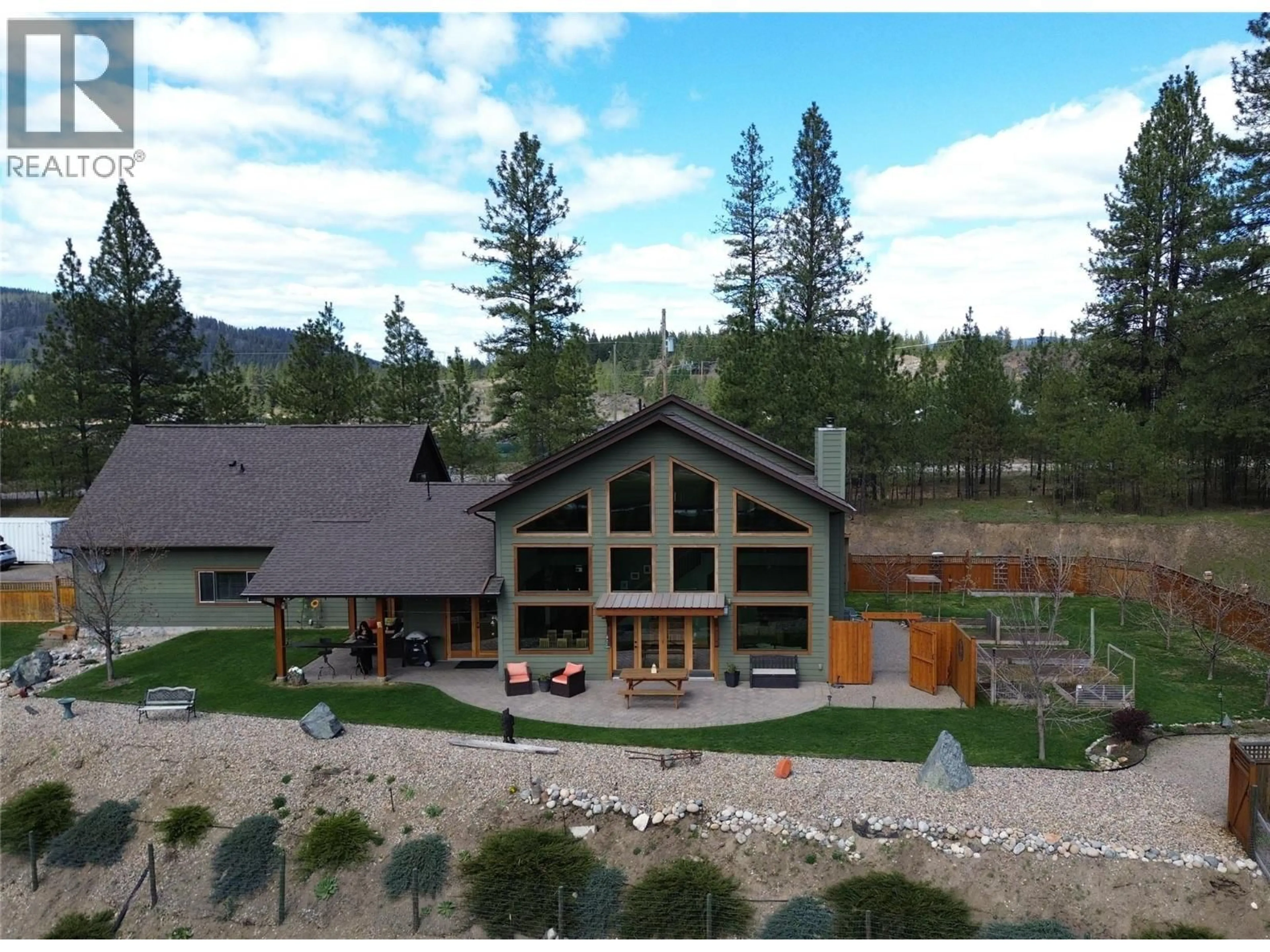 A pic from outside/outdoor area/front of a property/back of a property/a pic from drone, mountain view for 750 395 HIGHWAY, Christina Lake British Columbia V0H1E0