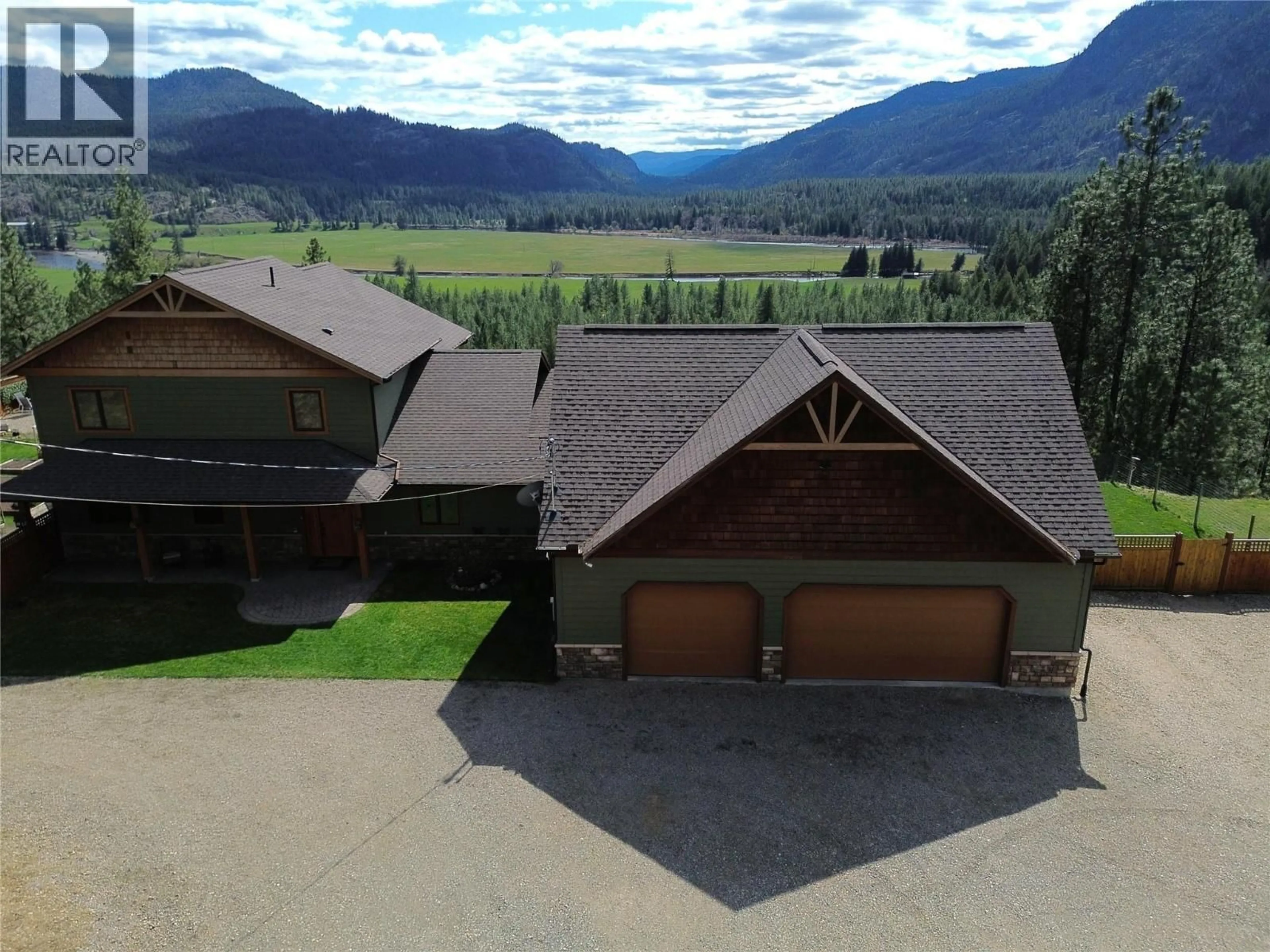 A pic from outside/outdoor area/front of a property/back of a property/a pic from drone, mountain view for 750 395 HIGHWAY, Christina Lake British Columbia V0H1E0