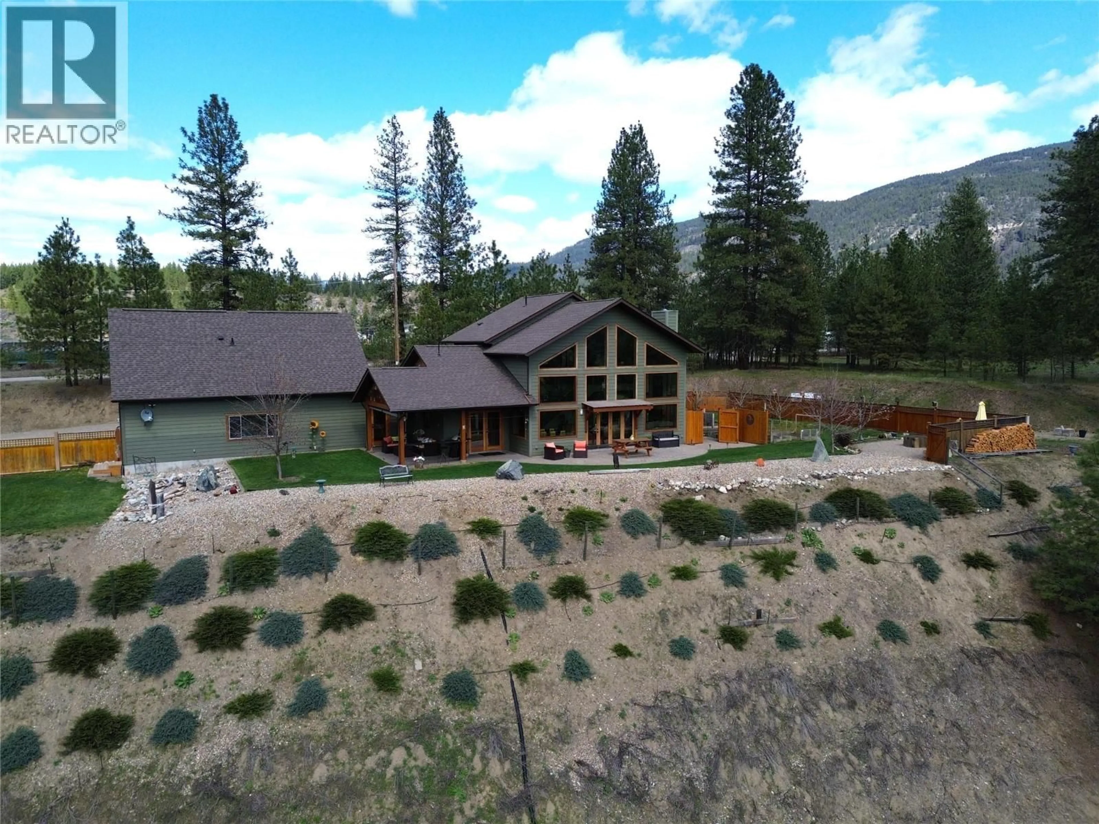 A pic from outside/outdoor area/front of a property/back of a property/a pic from drone, mountain view for 750 395 HIGHWAY, Christina Lake British Columbia V0H1E0