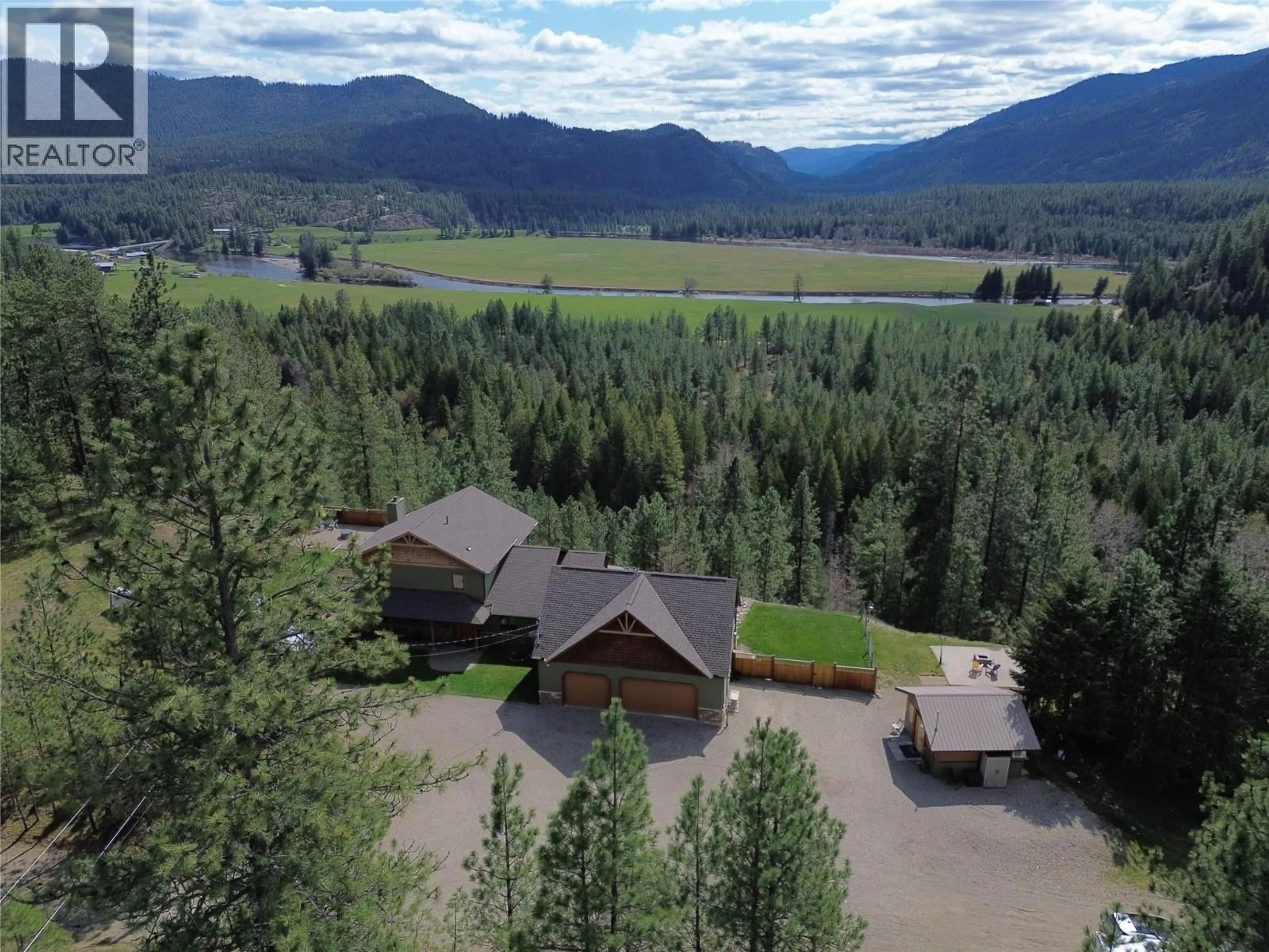 A pic from outside/outdoor area/front of a property/back of a property/a pic from drone, mountain view for 750 395 HIGHWAY, Christina Lake British Columbia V0H1E0