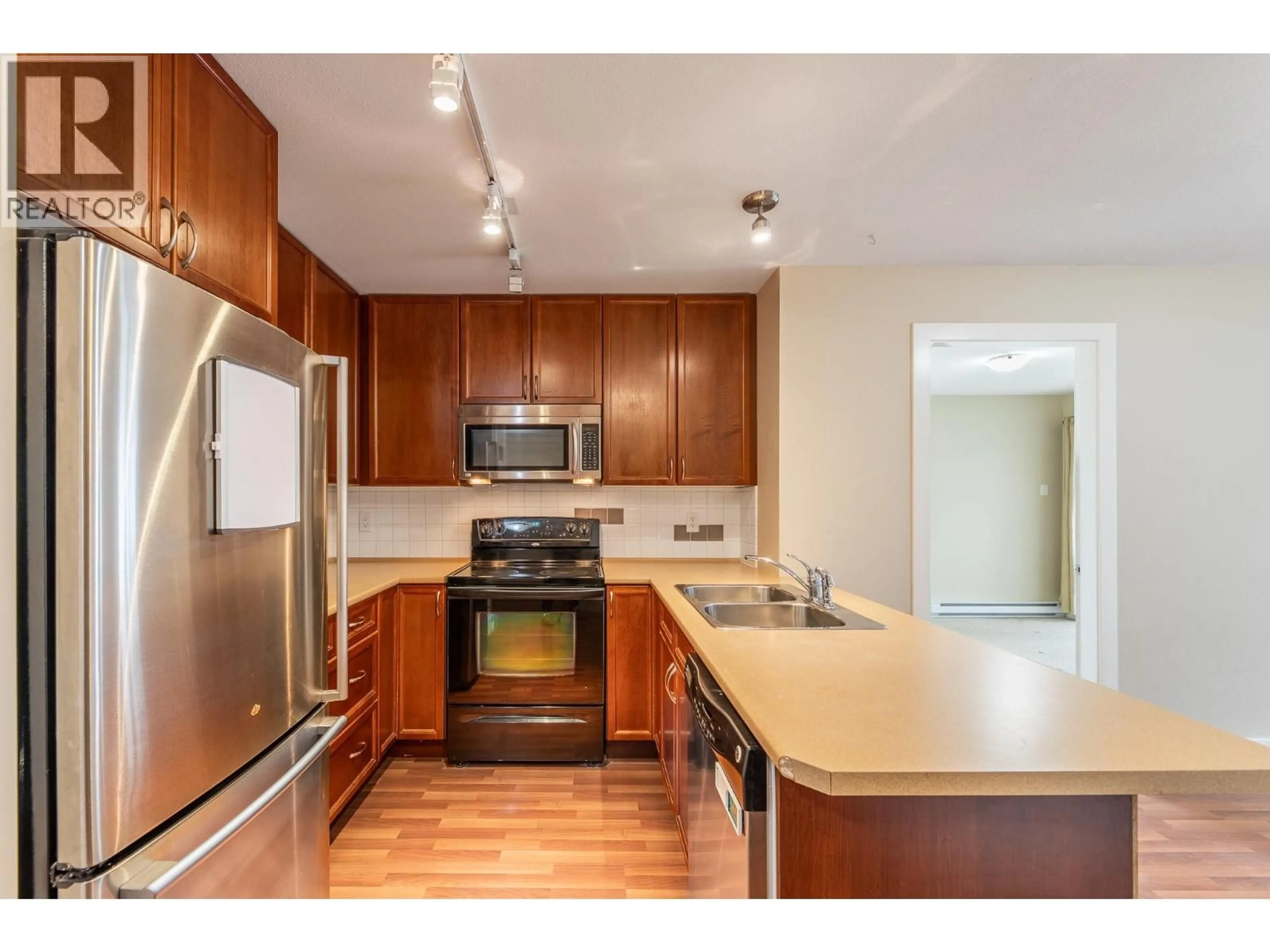 Standard kitchen, wood/laminate floor for 203 - 256 HASTINGS AVENUE, Penticton British Columbia V2A2V6