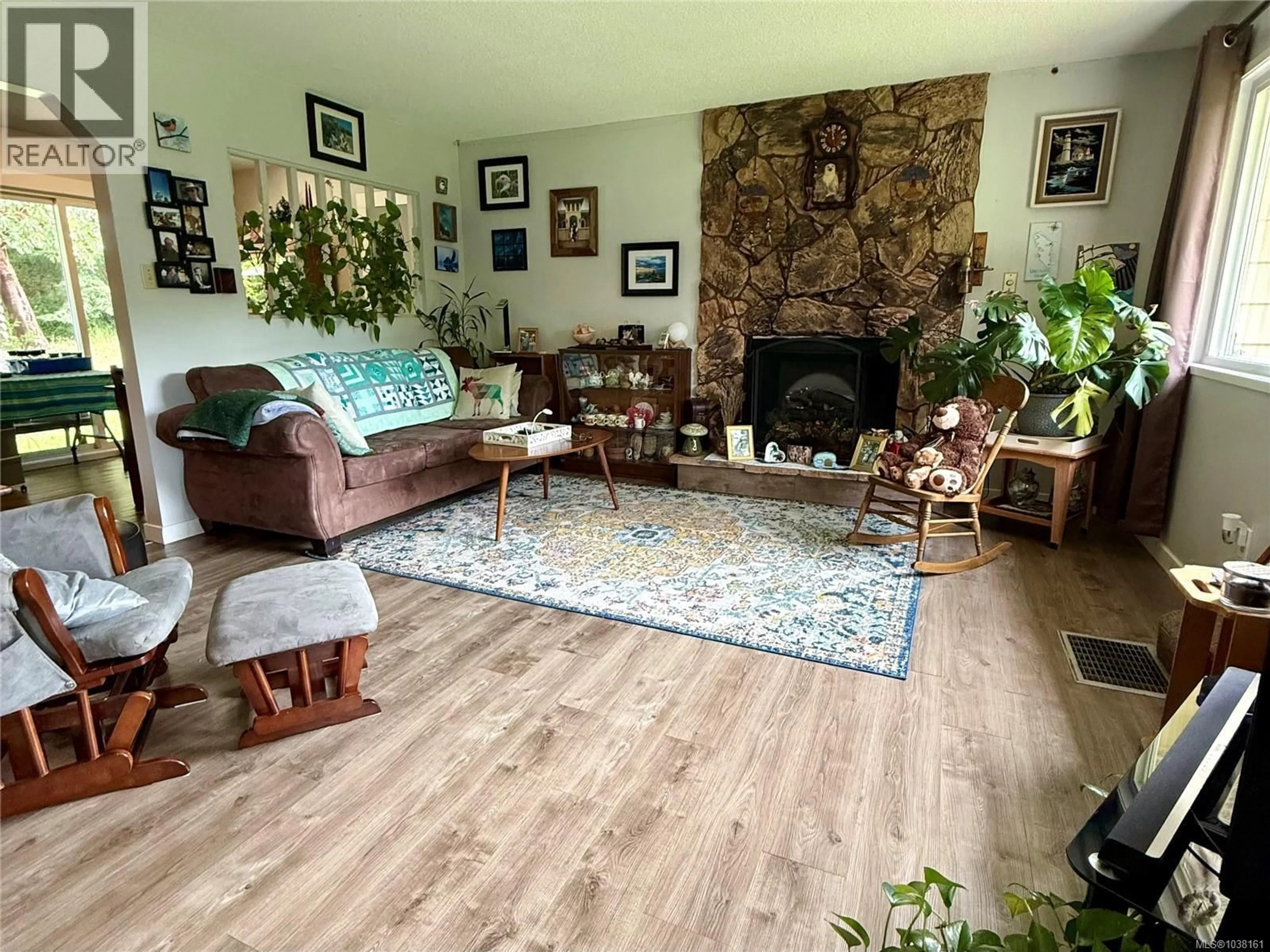 Living room with furniture, wood/laminate floor for 1673 NORTHWEST BAY ROAD, Nanoose Bay British Columbia V9P9C4