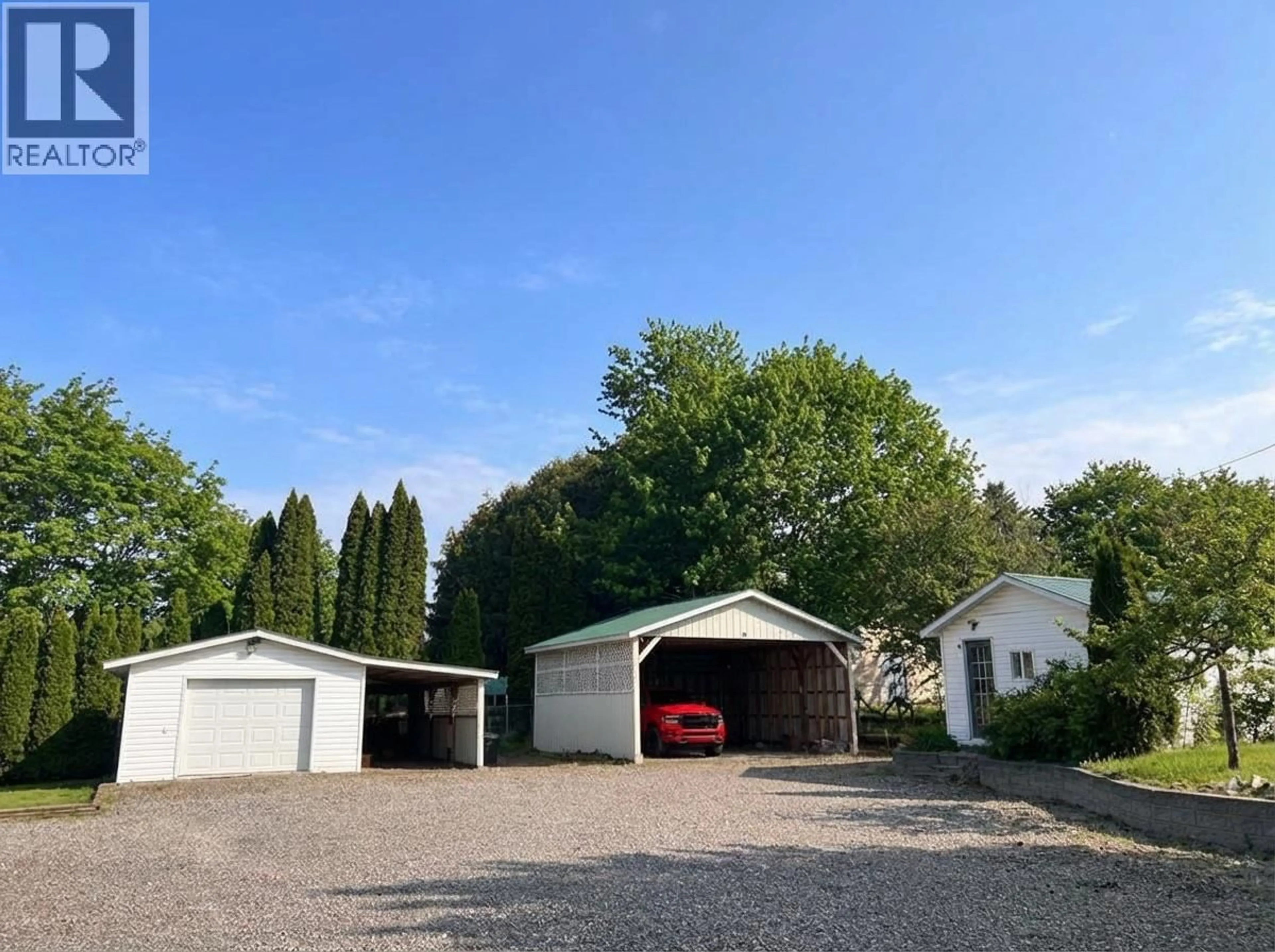 A pic from outside/outdoor area/front of a property/back of a property/a pic from drone, street for 3433 ERICKSON ROAD, Creston British Columbia V0B1G1