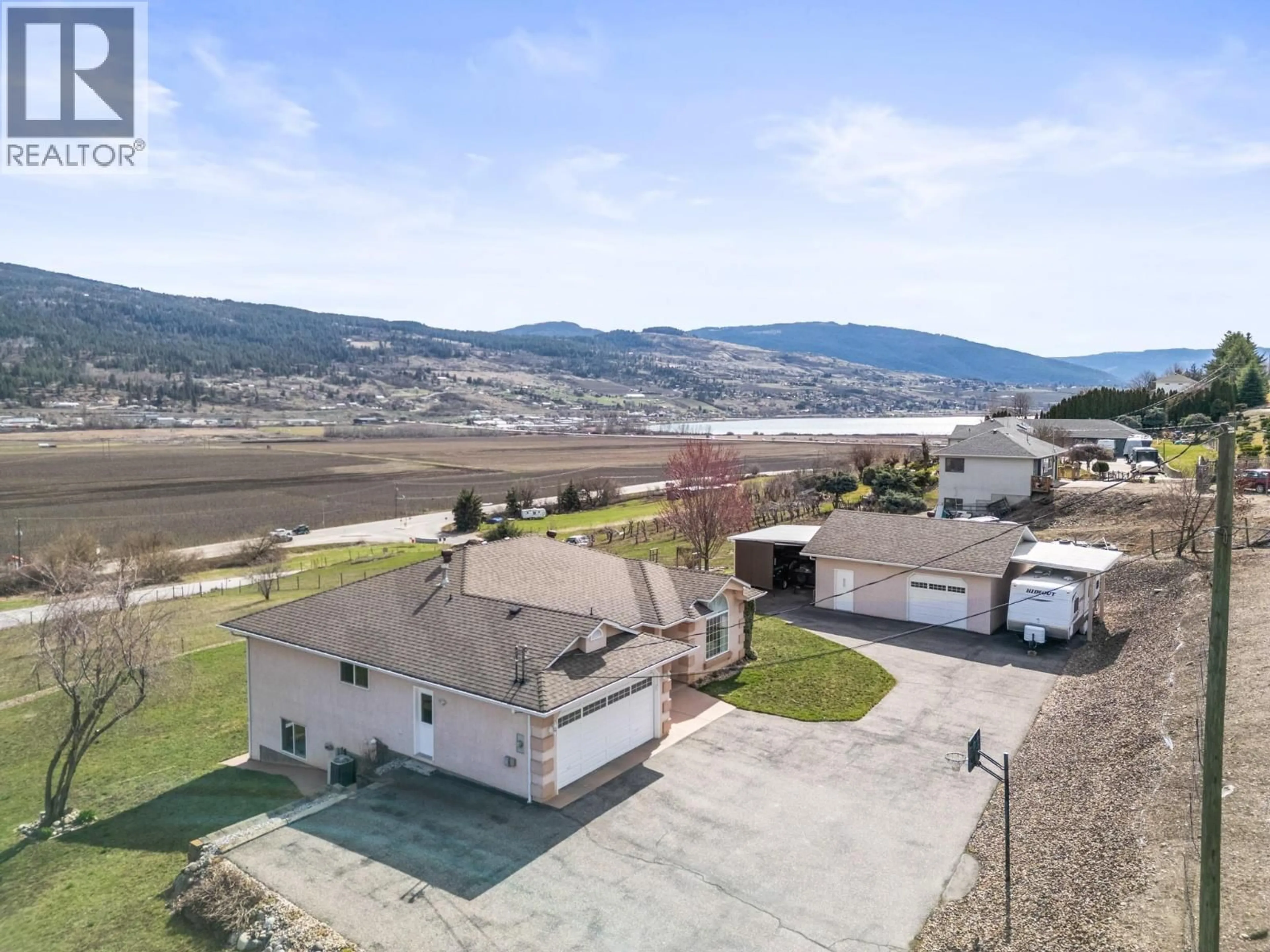 A pic from outside/outdoor area/front of a property/back of a property/a pic from drone, mountain view for 130 OVERLOOK PLACE, Spallumcheen British Columbia V1H1X1