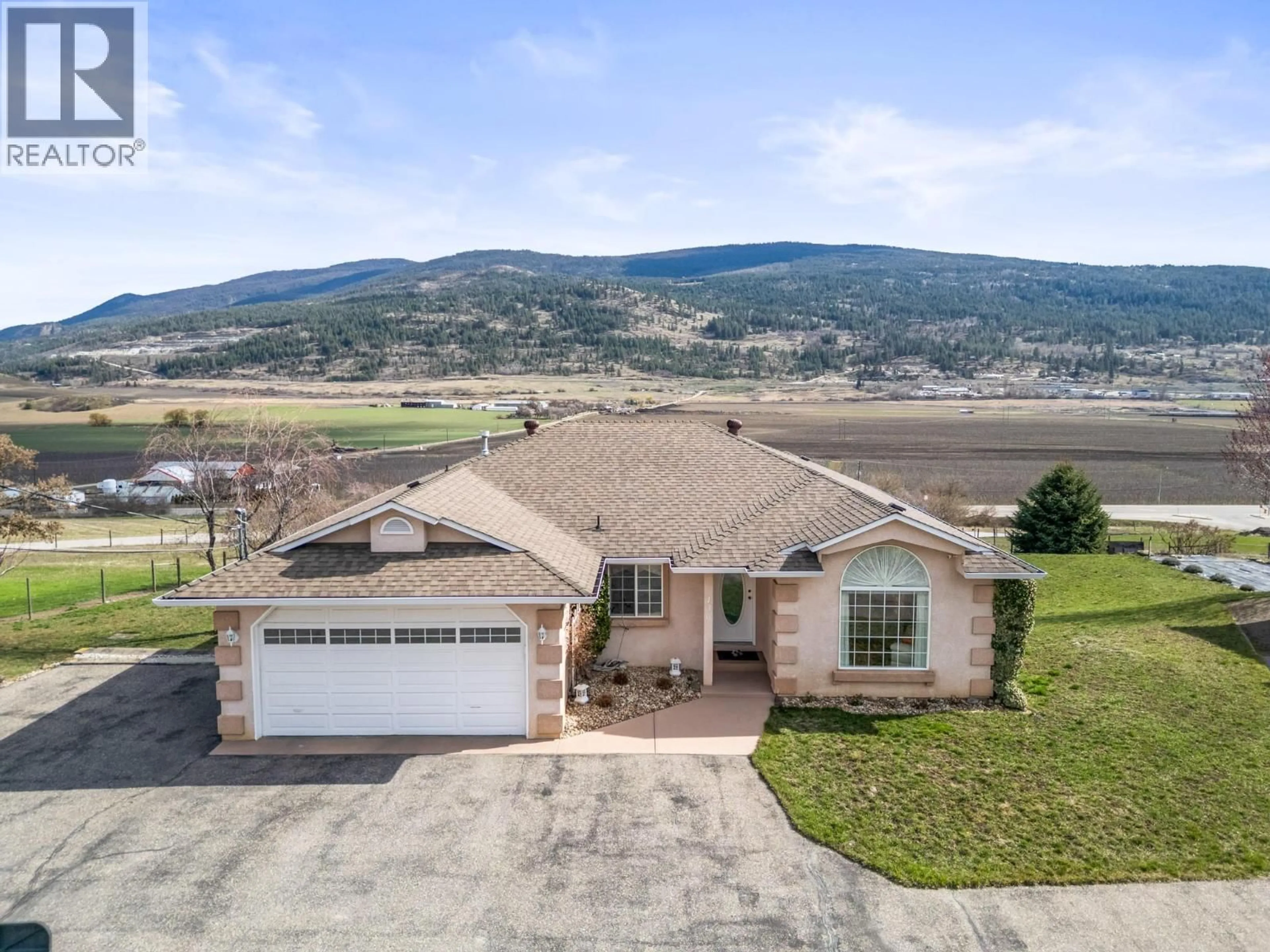 A pic from outside/outdoor area/front of a property/back of a property/a pic from drone, mountain view for 130 OVERLOOK PLACE, Spallumcheen British Columbia V1H1X1