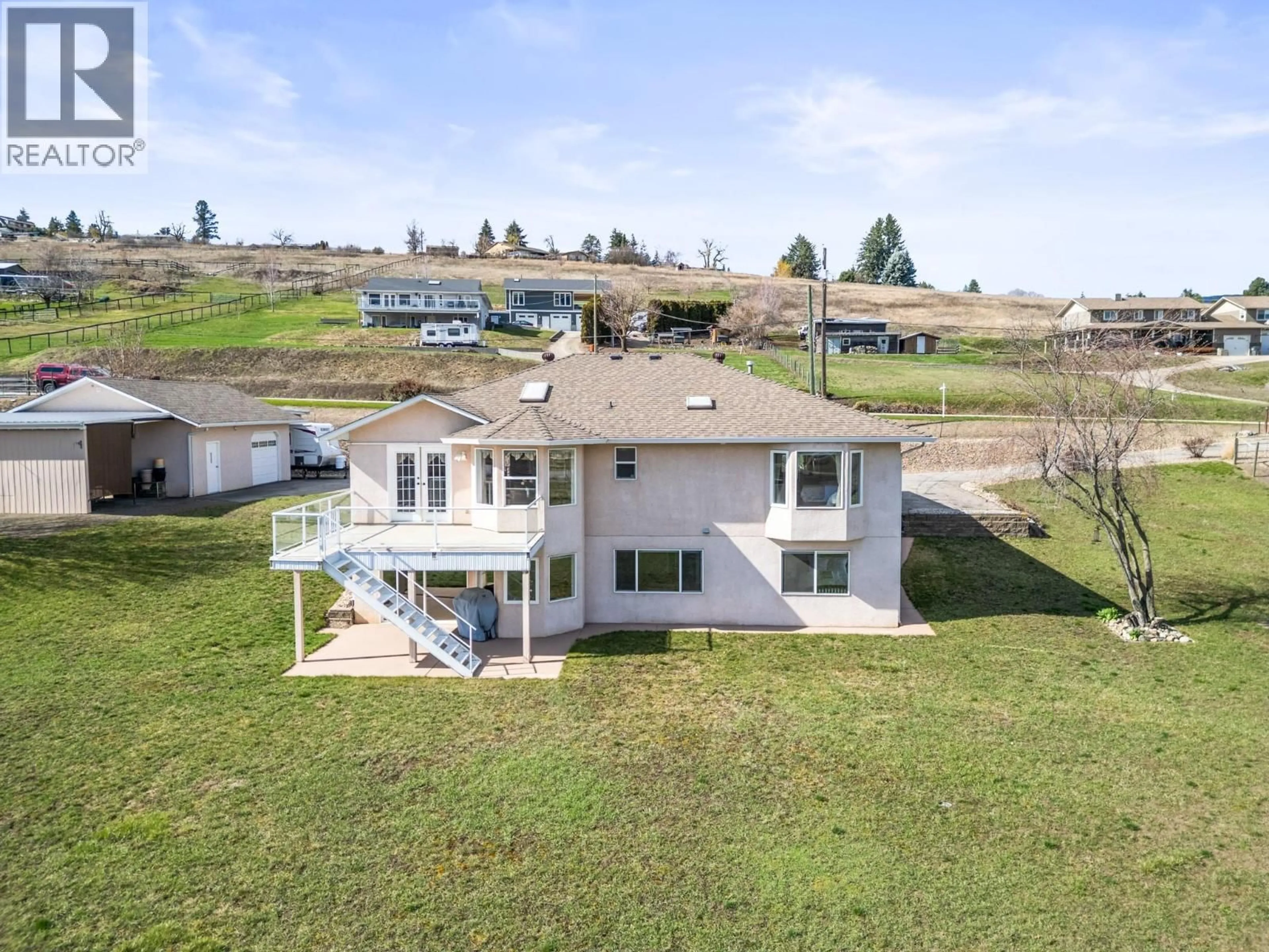 A pic from outside/outdoor area/front of a property/back of a property/a pic from drone, water/lake/river/ocean view for 130 OVERLOOK PLACE, Spallumcheen British Columbia V1H1X1
