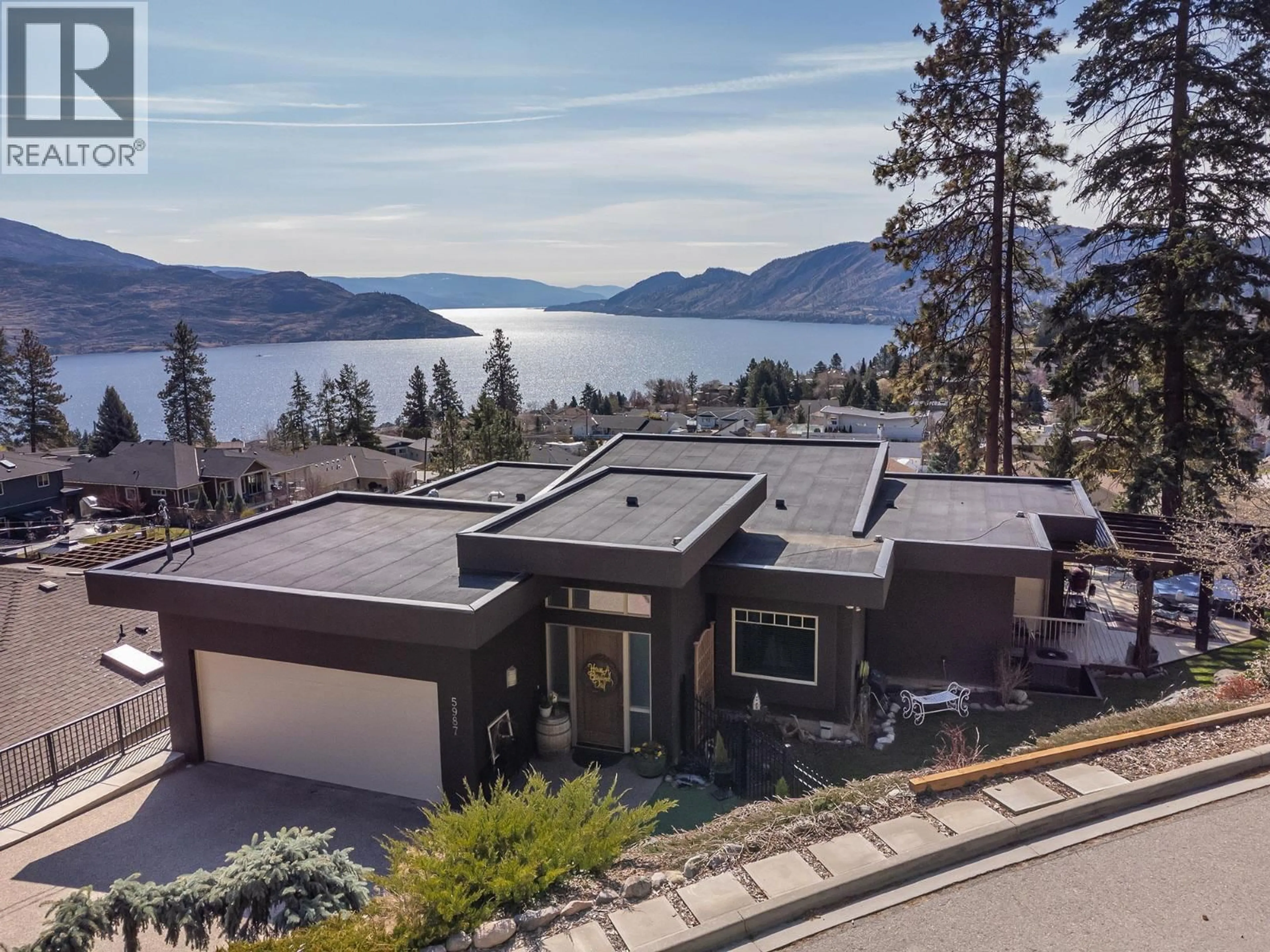 A pic from outside/outdoor area/front of a property/back of a property/a pic from drone, water/lake/river/ocean view for 5987 MELDRUM PLACE, Peachland British Columbia V0H1X4