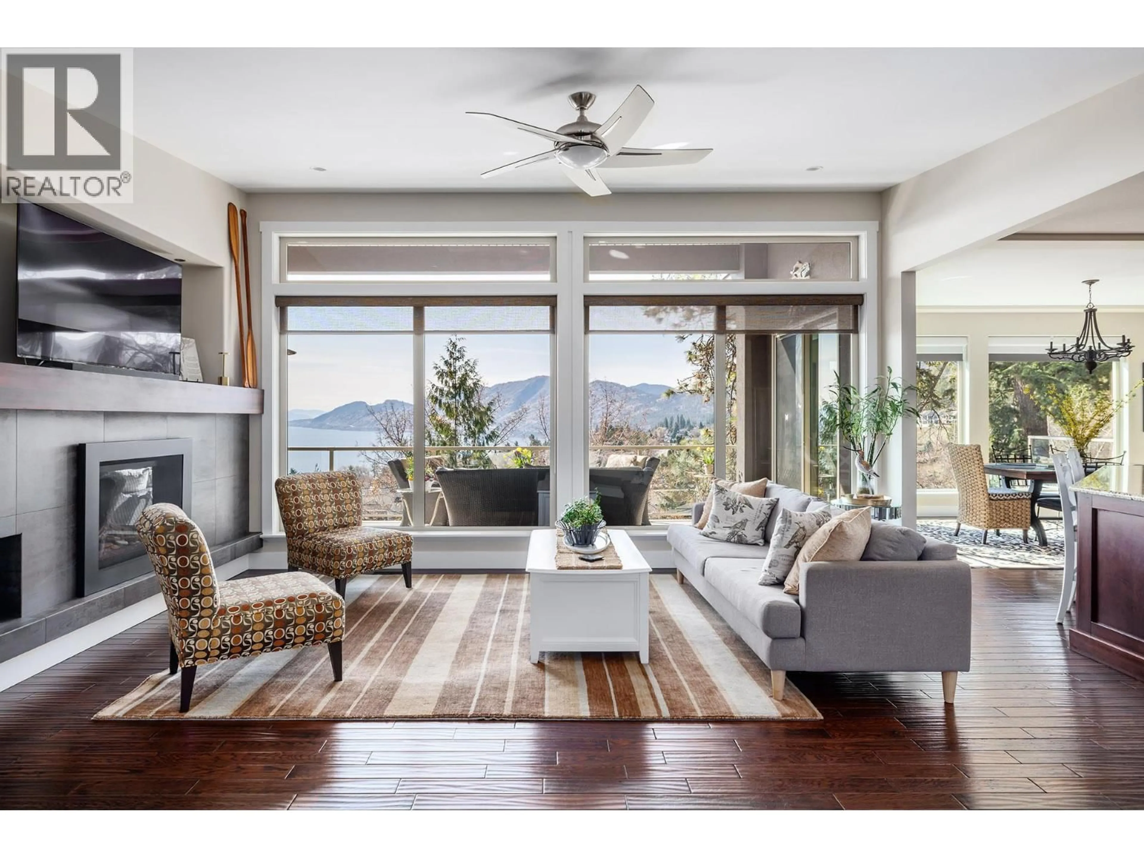 Living room with furniture, wood/laminate floor for 5987 MELDRUM PLACE, Peachland British Columbia V0H1X4