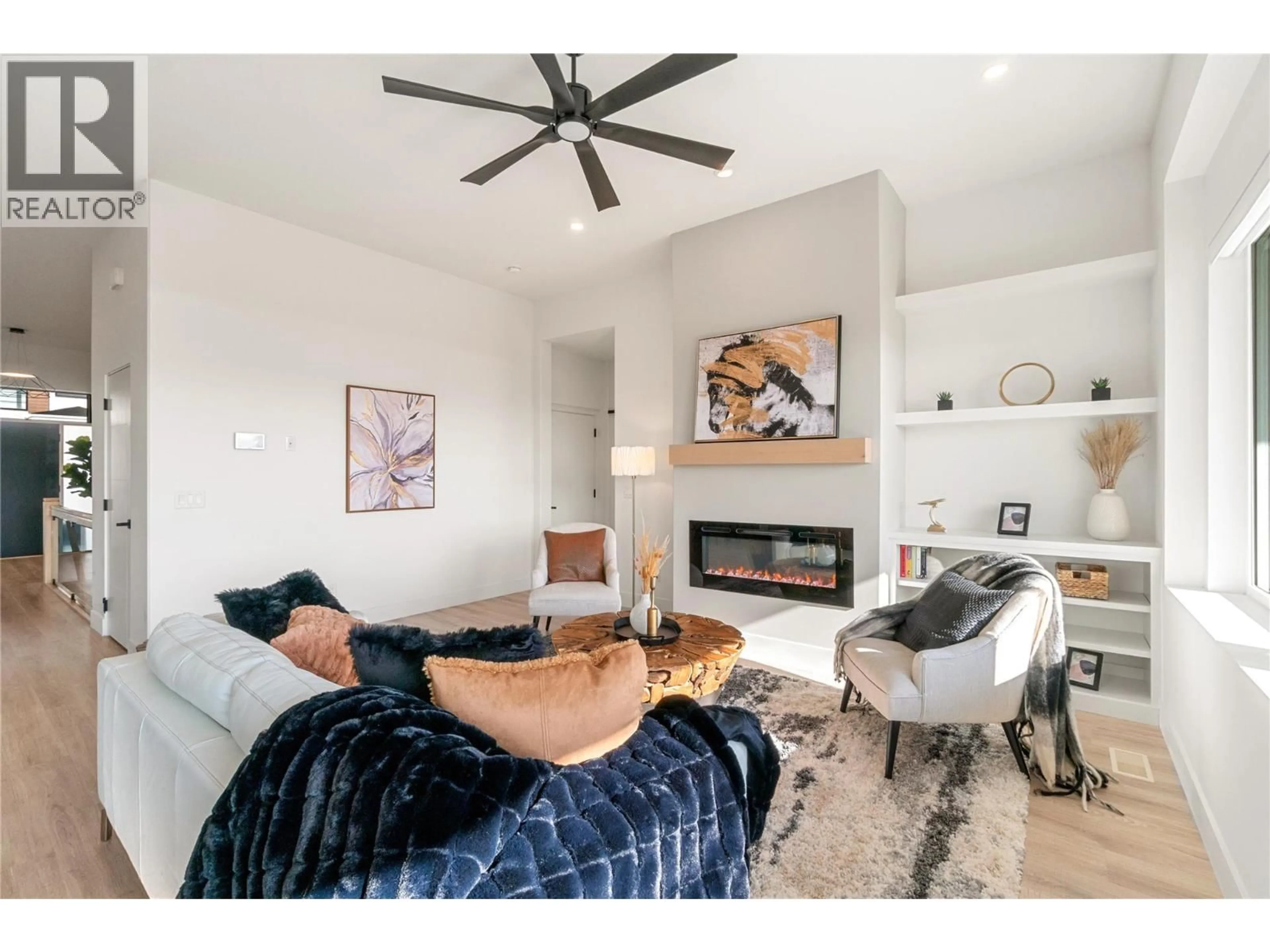 Living room with furniture, wood/laminate floor for 2827 COPPER RIDGE DRIVE, West Kelowna British Columbia V4T0E7