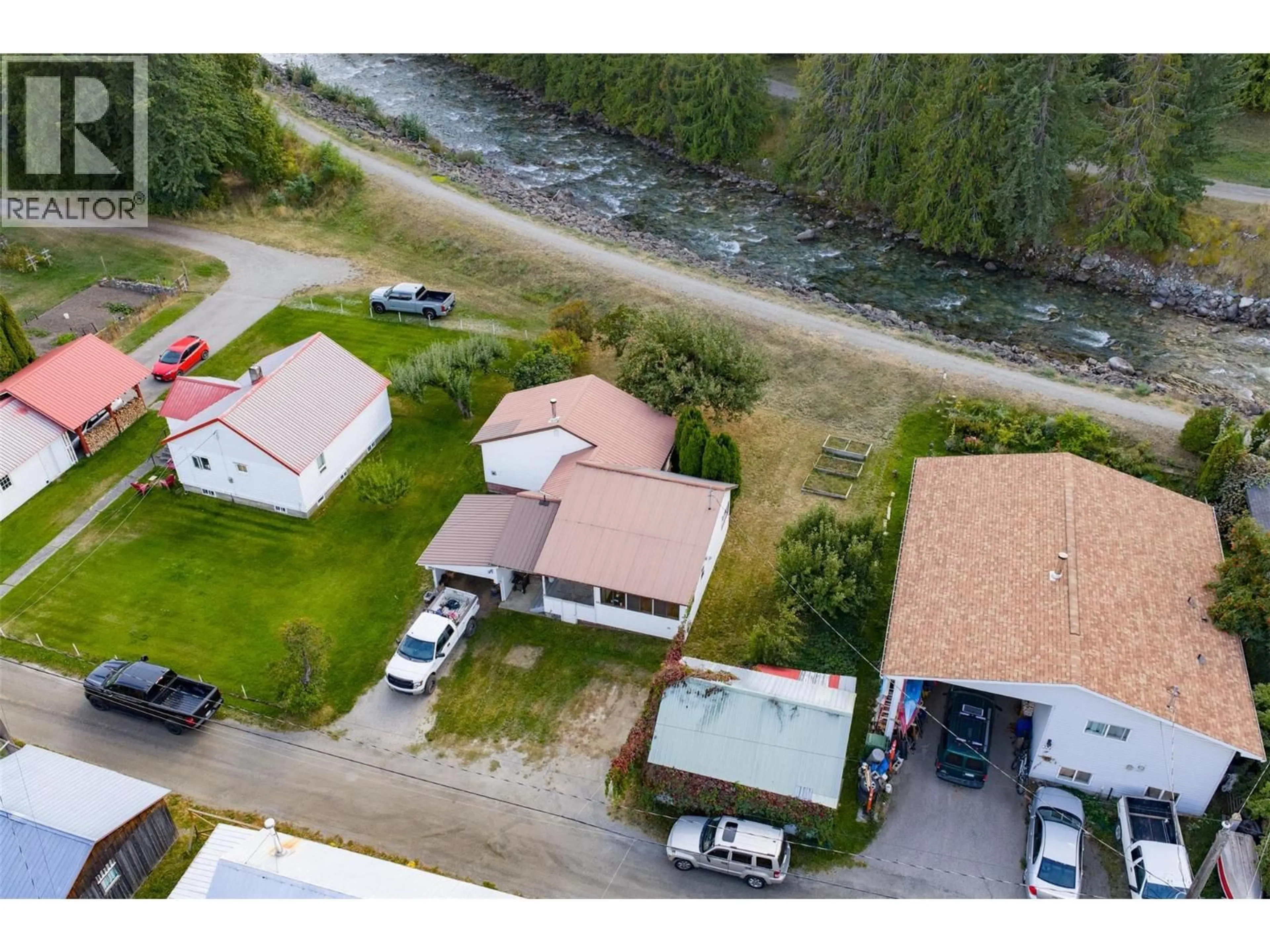 A pic from outside/outdoor area/front of a property/back of a property/a pic from drone, water/lake/river/ocean view for 320 RIVER LANE, Kaslo British Columbia V0G1M0