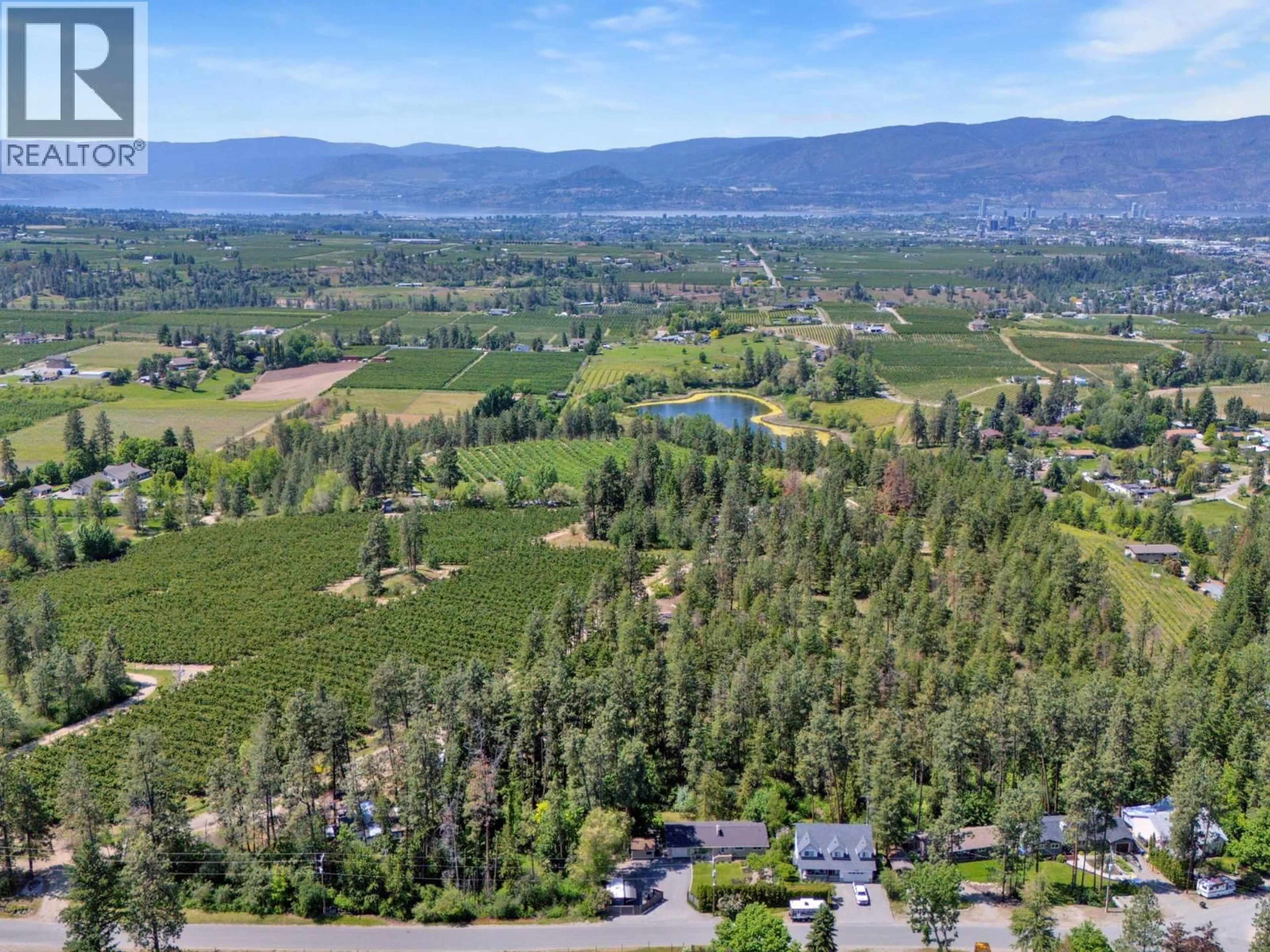 A pic from outside/outdoor area/front of a property/back of a property/a pic from drone, mountain view for 1766 GARNER ROAD, Kelowna British Columbia V1P1E5