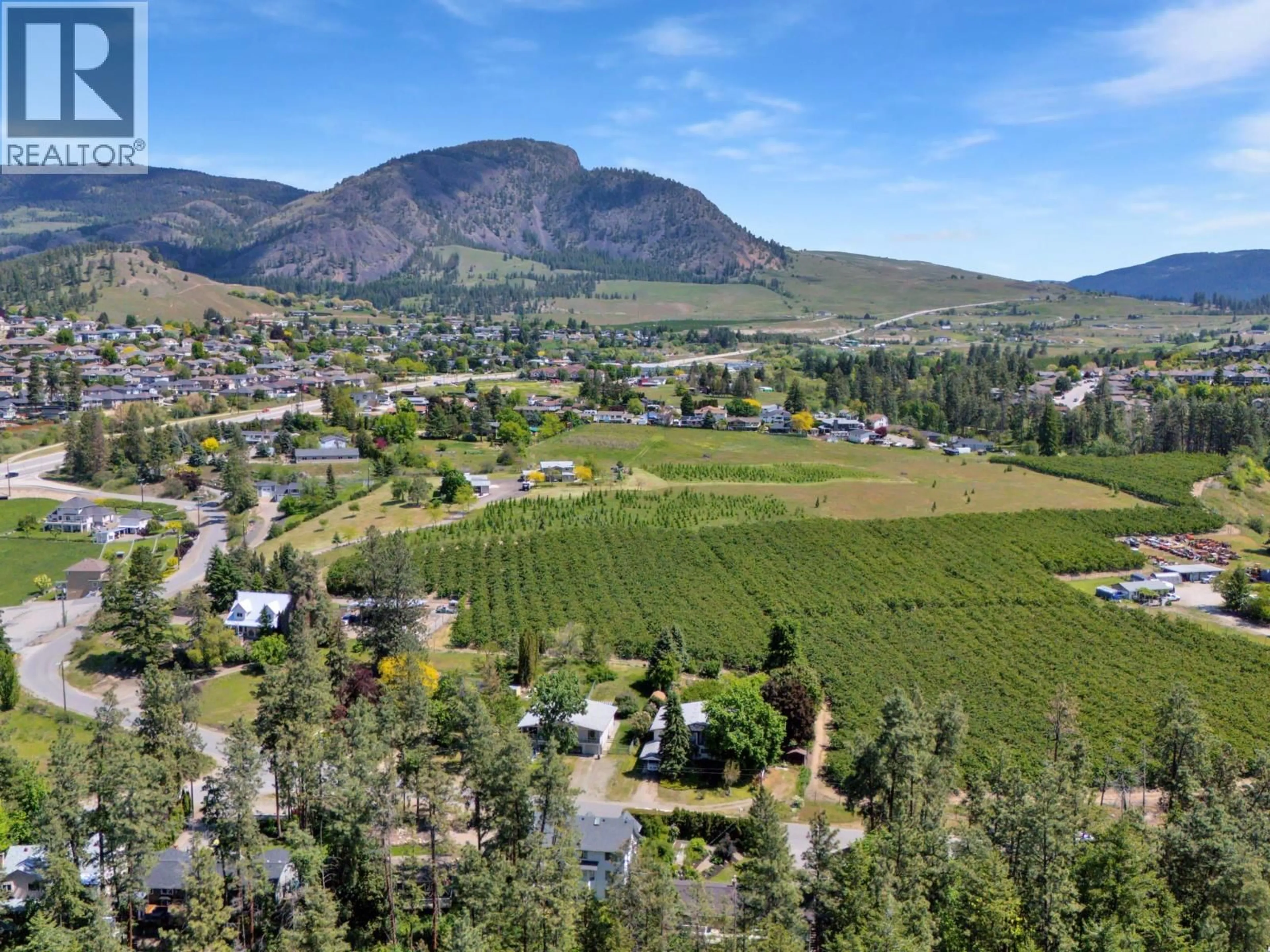 A pic from outside/outdoor area/front of a property/back of a property/a pic from drone, mountain view for 1766 GARNER ROAD, Kelowna British Columbia V1P1E5