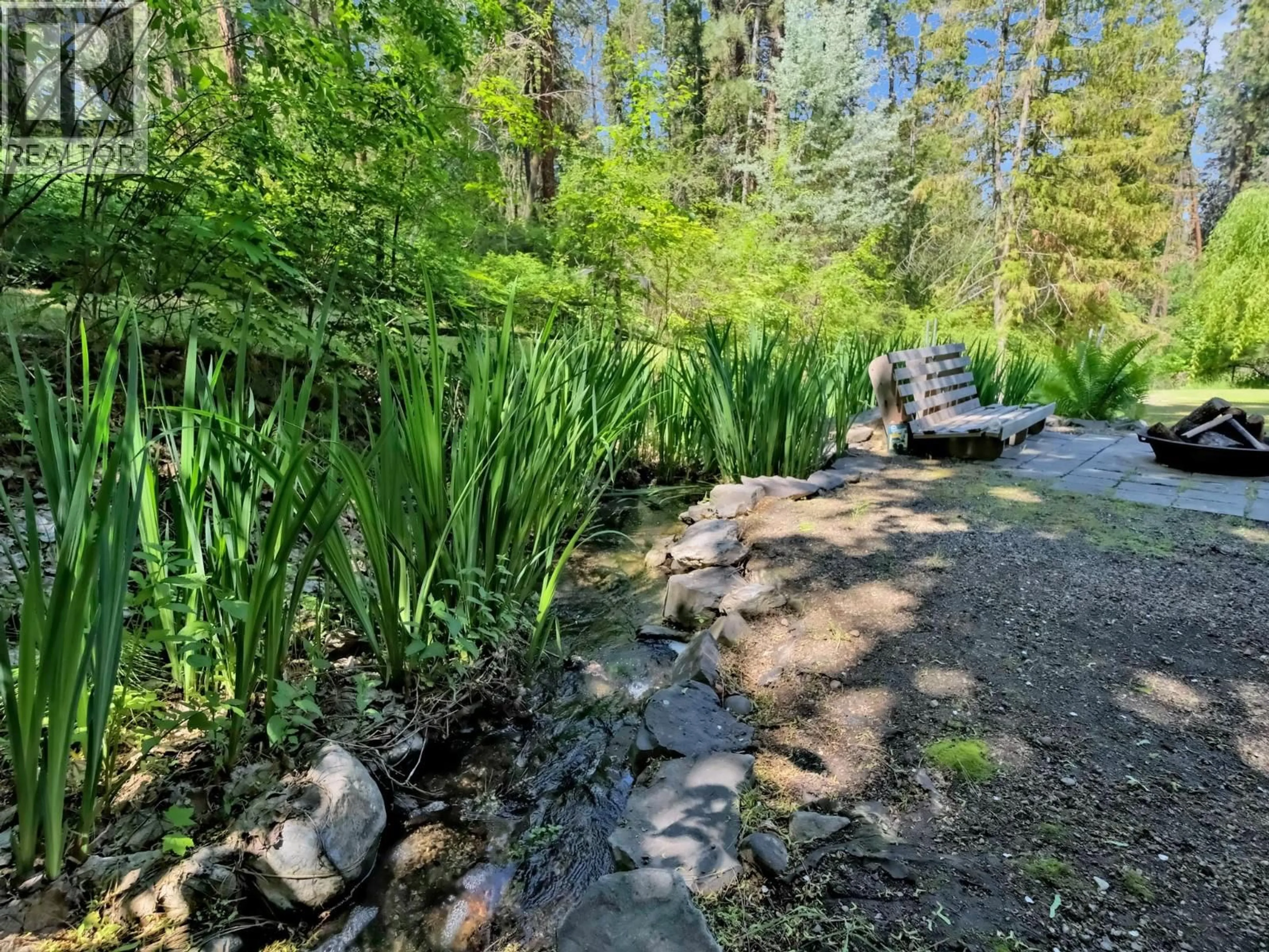 A pic from outside/outdoor area/front of a property/back of a property/a pic from drone, forest/trees view for 1766 GARNER ROAD, Kelowna British Columbia V1P1E5