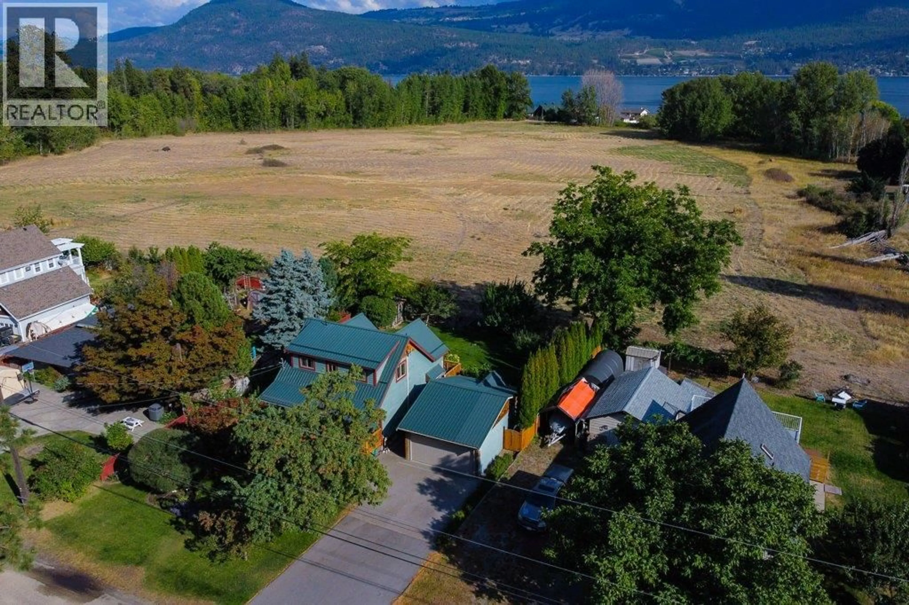 A pic from outside/outdoor area/front of a property/back of a property/a pic from drone, water/lake/river/ocean view for 7331 FINTRY DELTA ROAD, Kelowna British Columbia V1Z3V2