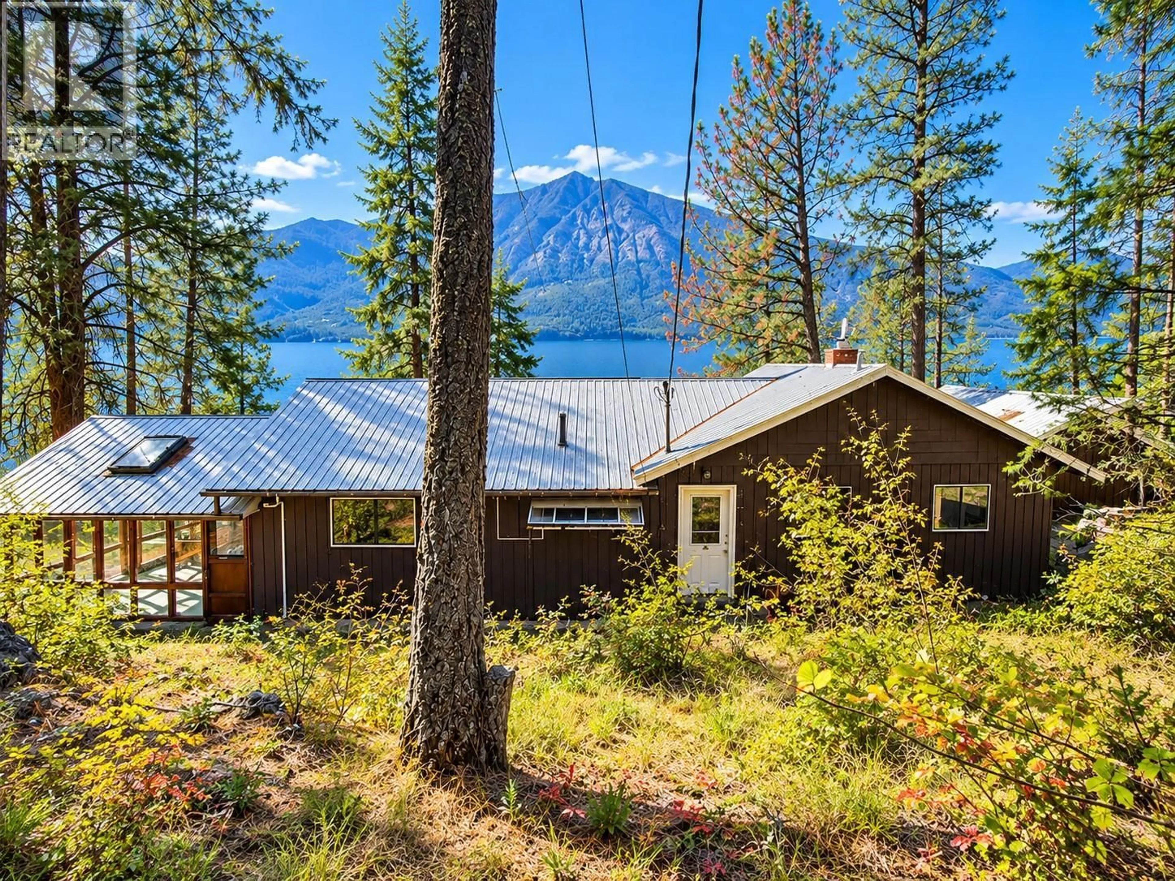 A pic from outside/outdoor area/front of a property/back of a property/a pic from drone, water/lake/river/ocean view for 9779 3A HIGHWAY, Kuskanook British Columbia V0B1A1