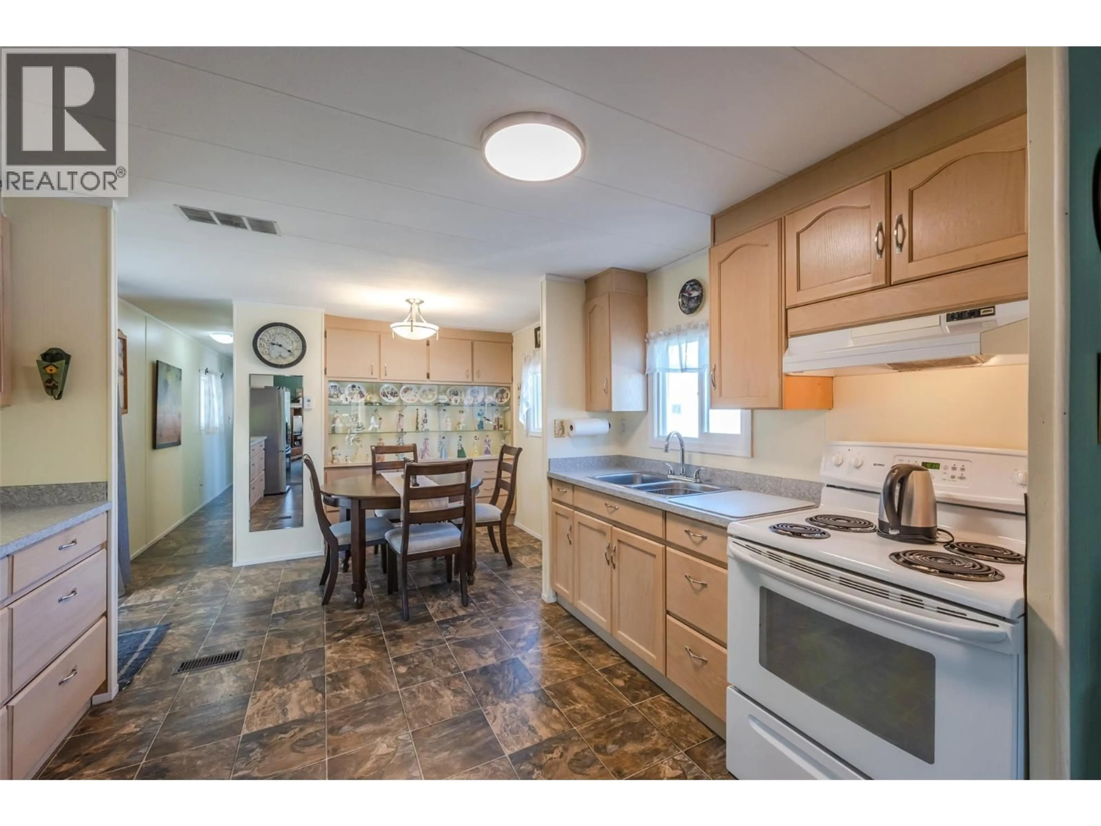 Open concept kitchen, ceramic/tile floor for 49 - 197 DAUPHIN AVENUE, Penticton British Columbia V2A3S3