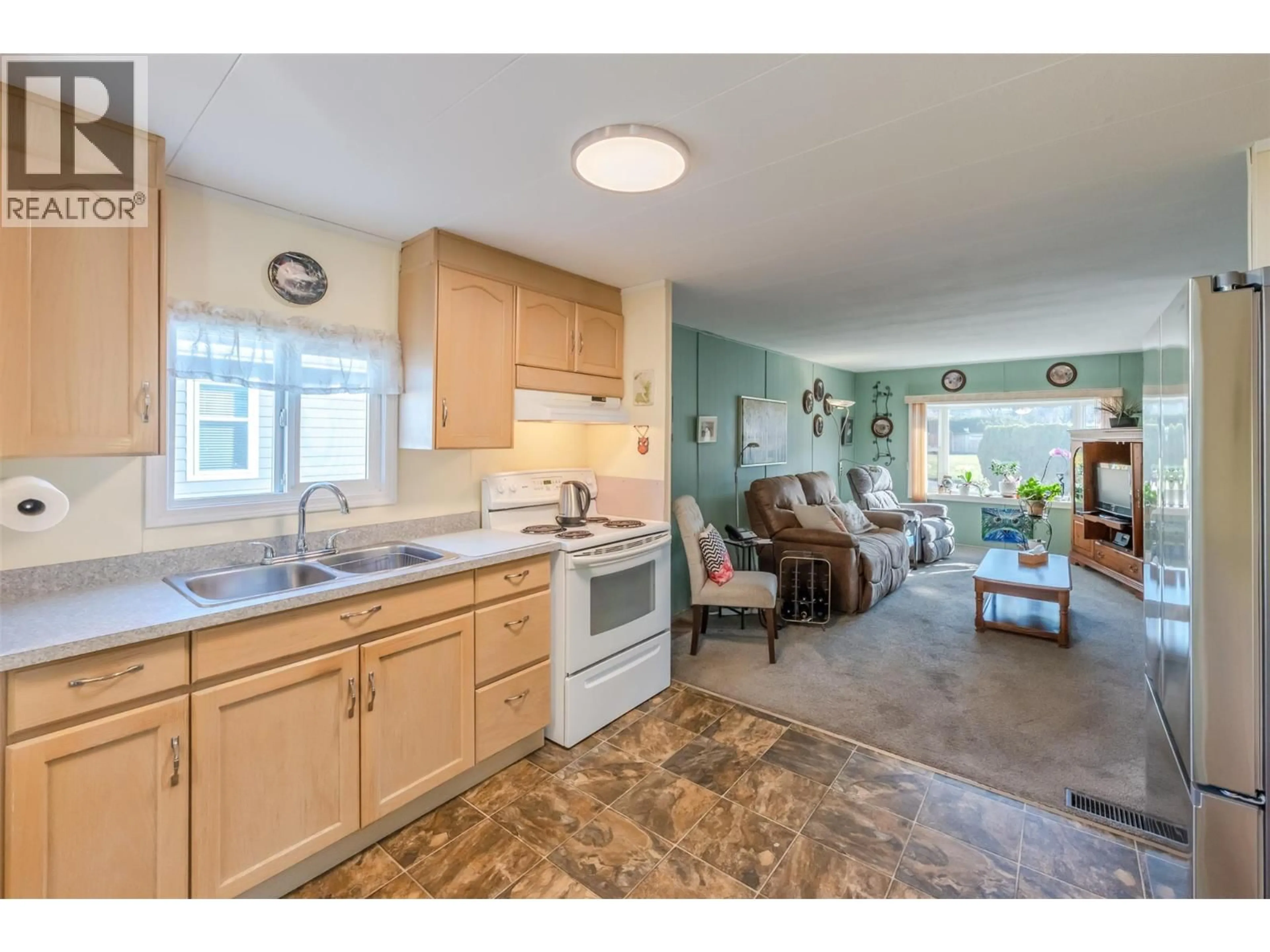 Open concept kitchen, ceramic/tile floor for 49 - 197 DAUPHIN AVENUE, Penticton British Columbia V2A3S3