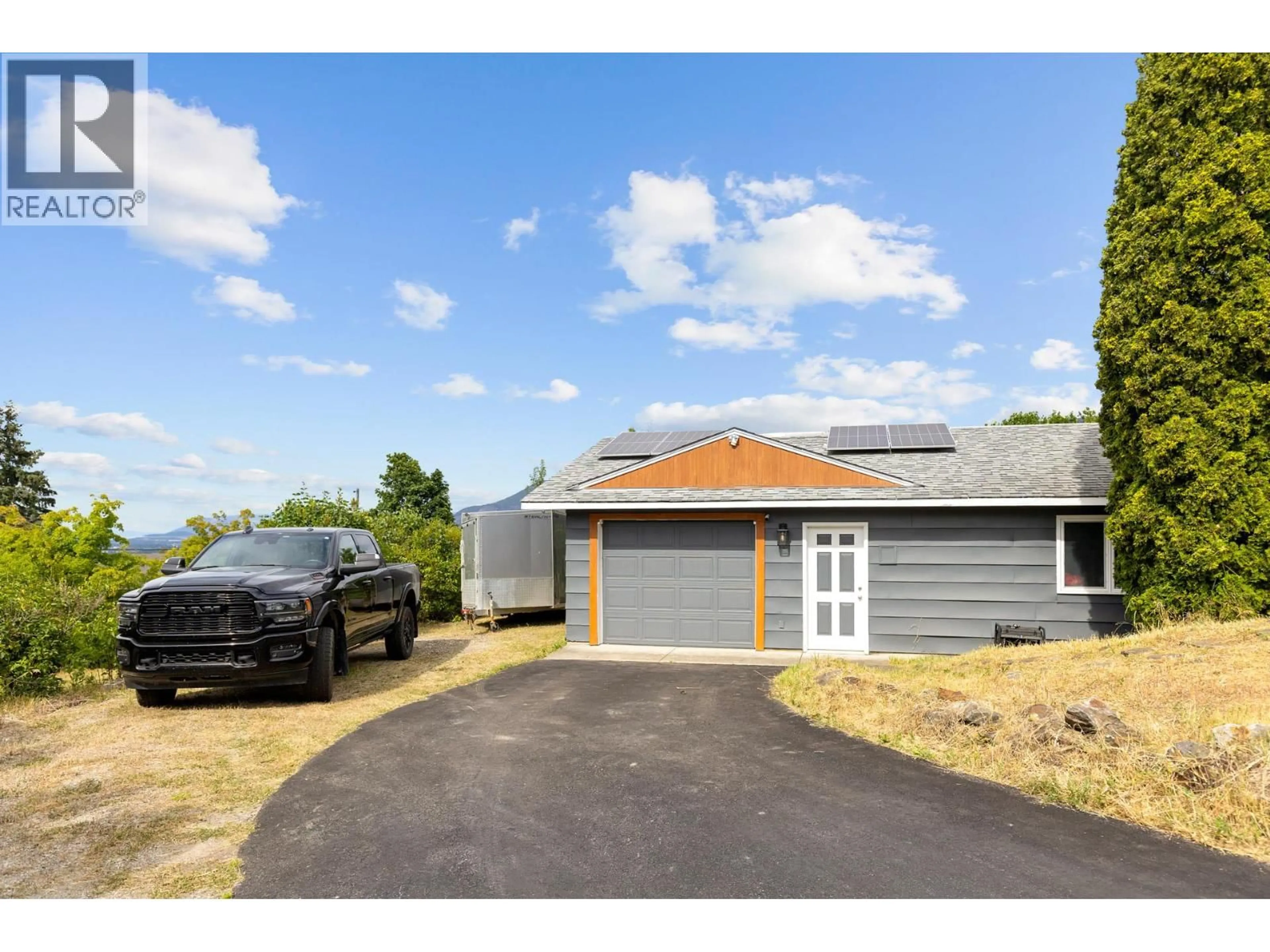 A pic from outside/outdoor area/front of a property/back of a property/a pic from drone, street for 136 STEPPING STONES CRESCENT, Spallumcheen British Columbia V1H1X2