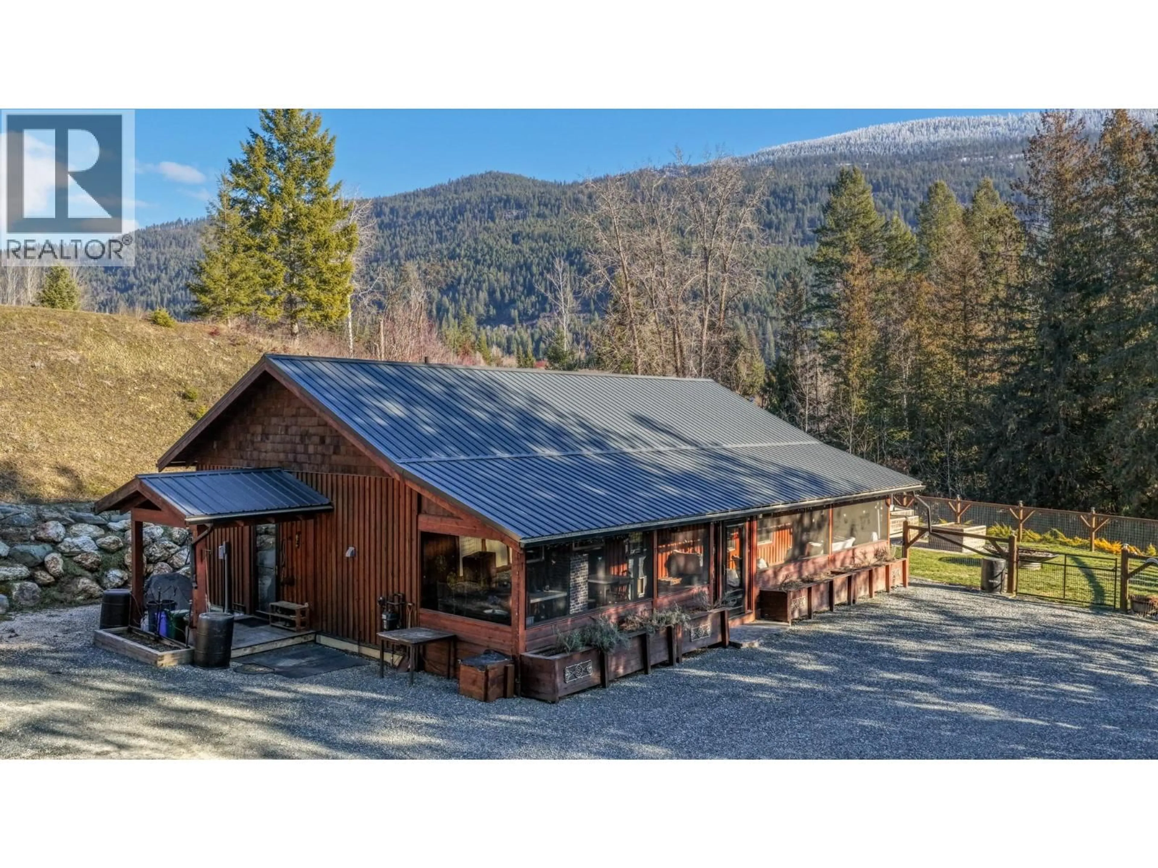 A pic from outside/outdoor area/front of a property/back of a property/a pic from drone, mountain view for 1627 HOOD ROAD ROAD, Creston British Columbia V0B1G2