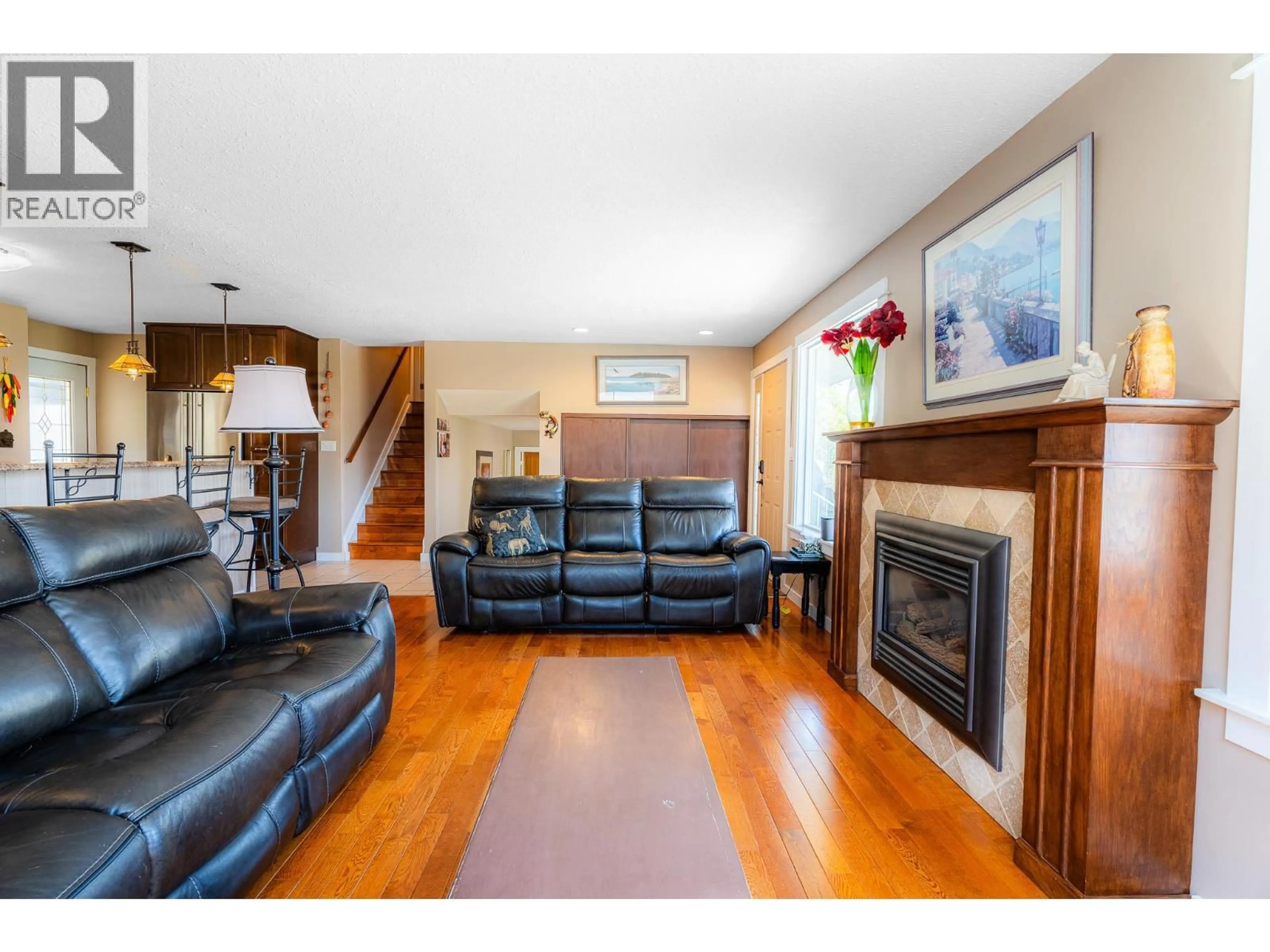 Living room with furniture, wood/laminate floor for 255 ST PAUL STREET WEST, Kamloops British Columbia V2C1G2