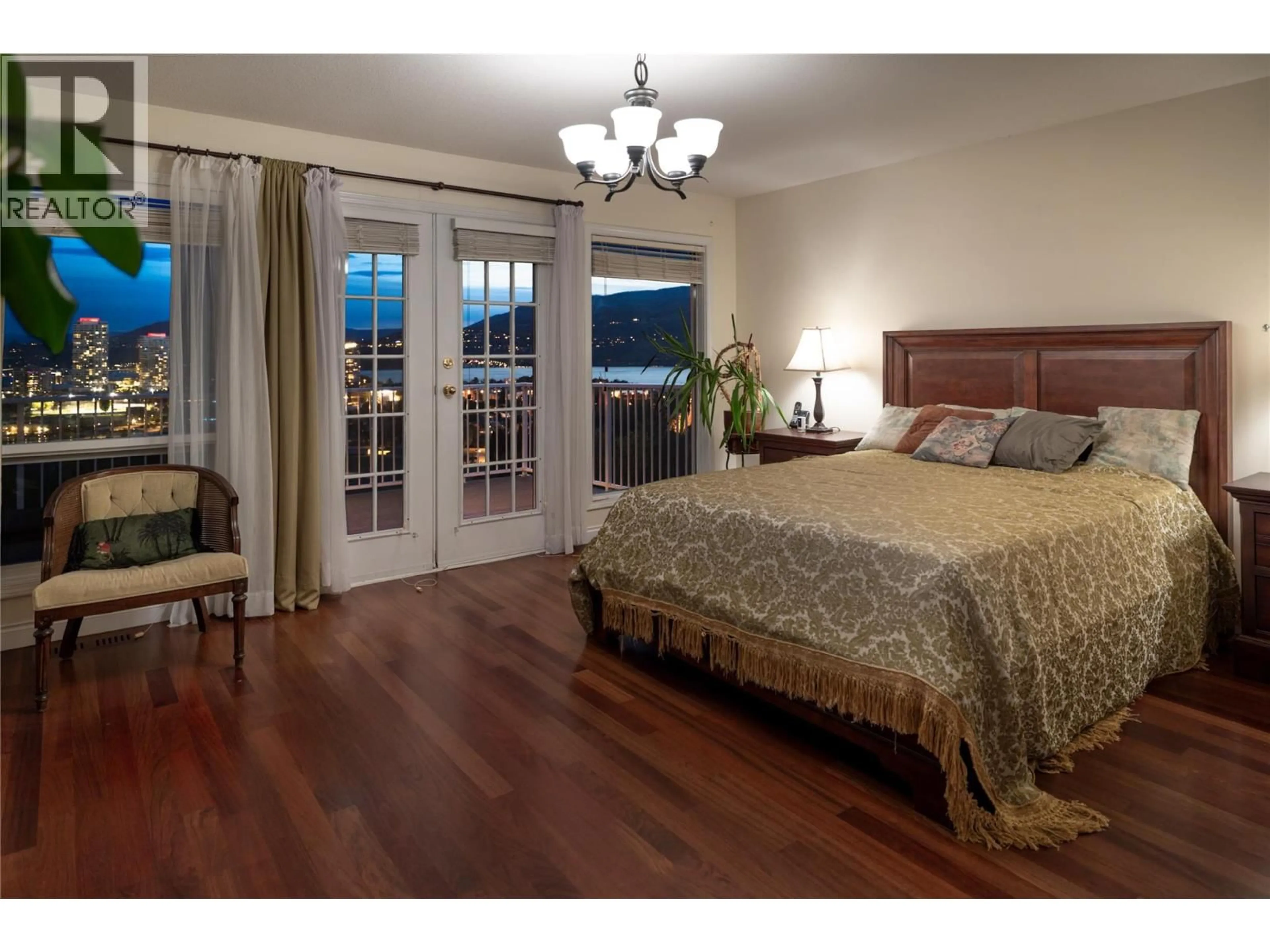 Bedroom with bed, wood/laminate floor for 740 ROYAL PINE DRIVE, Kelowna British Columbia V1Y9G2