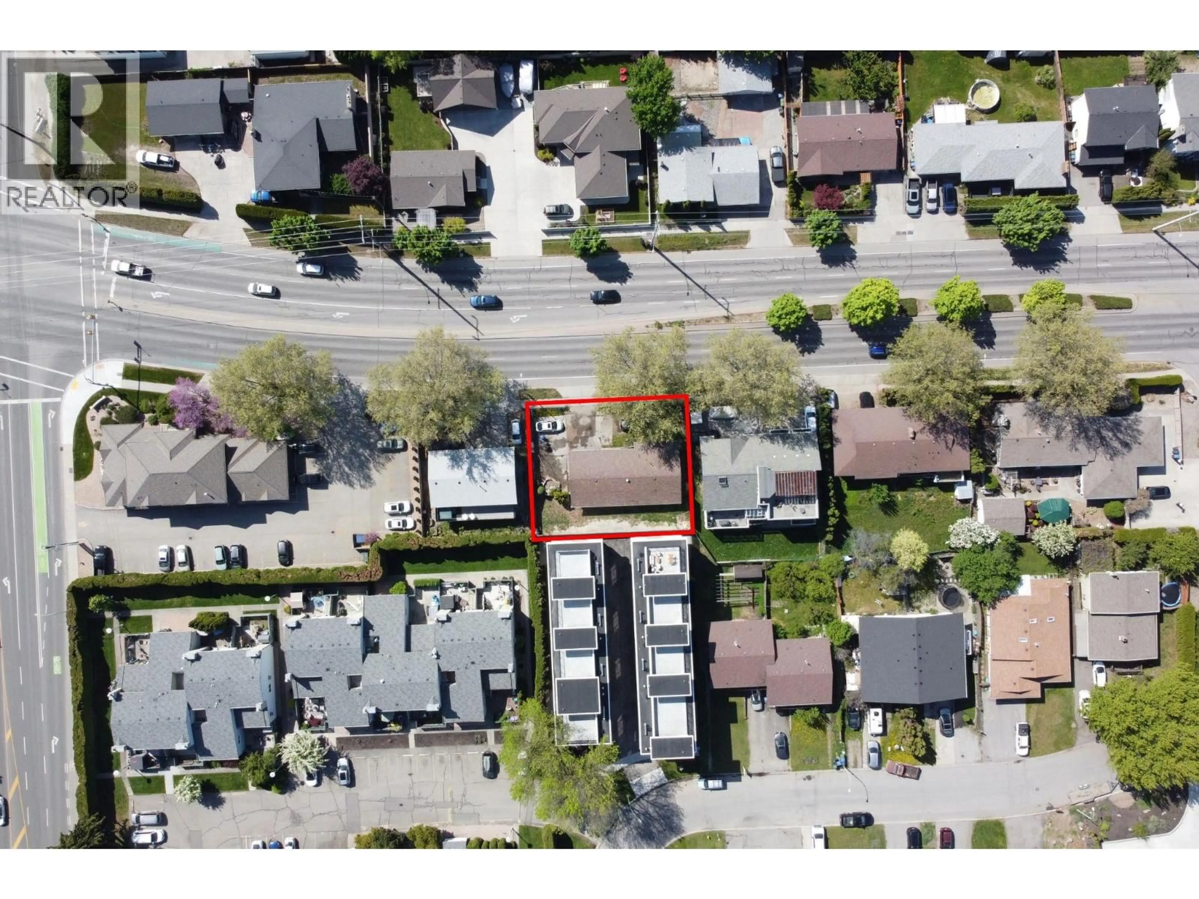 A pic from outside/outdoor area/front of a property/back of a property/a pic from drone, street for 1456 SPRINGFIELD ROAD, Kelowna British Columbia V1Y5V3