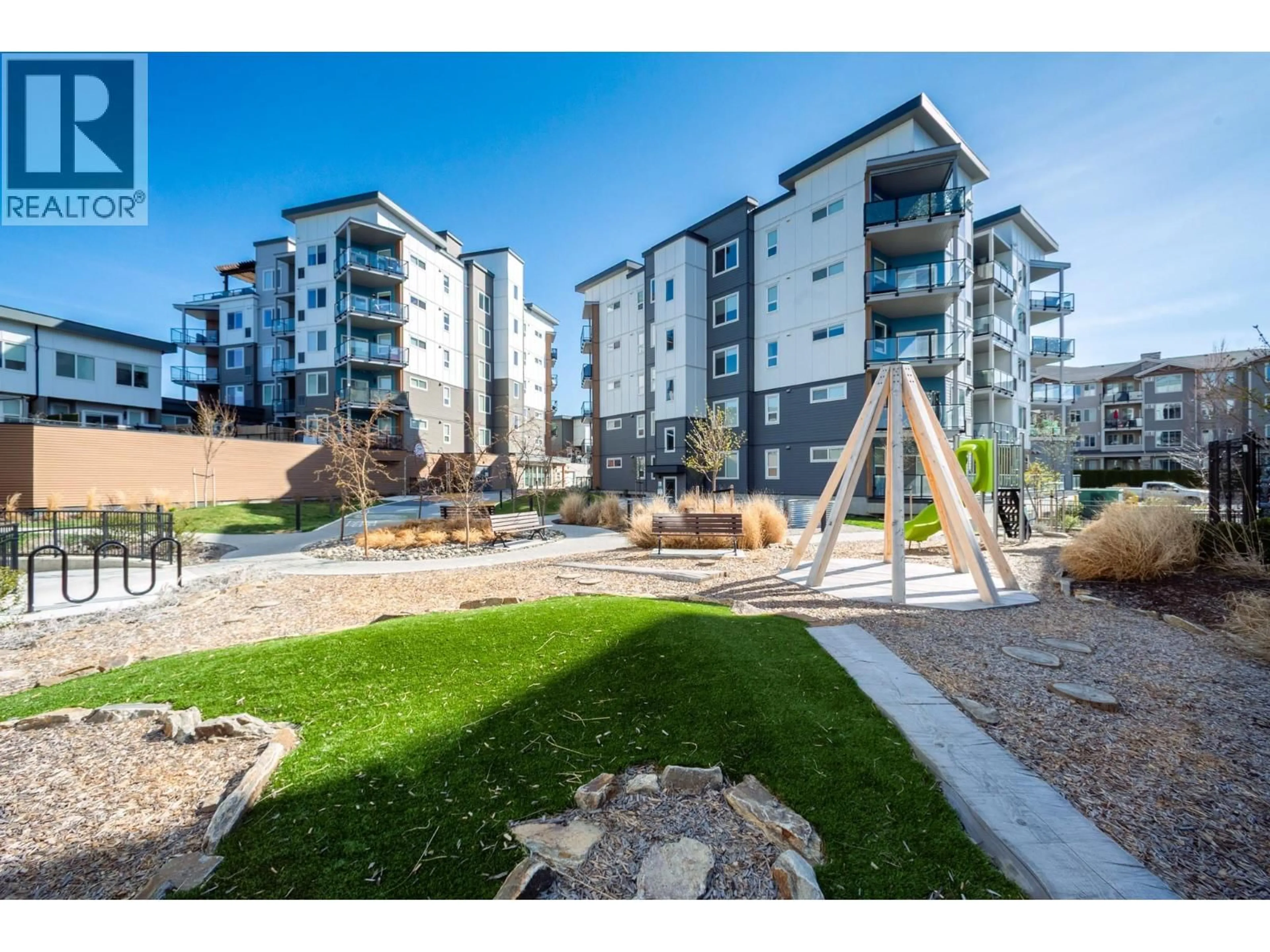 A pic from outside/outdoor area/front of a property/back of a property/a pic from drone, mountain view for 204 - 3642 MISSION SPRINGS DRIVE, Kelowna British Columbia V1W0E1