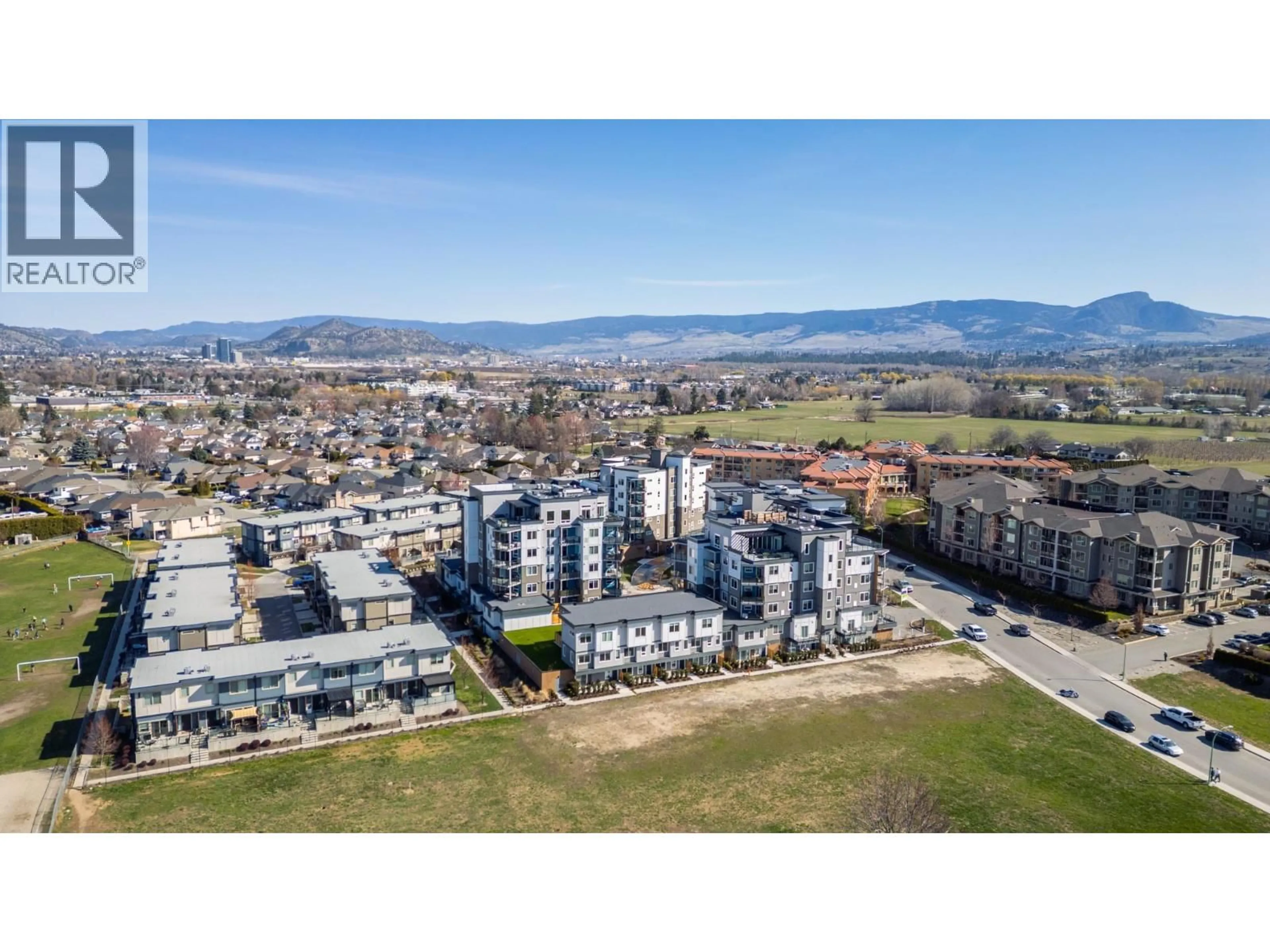 A pic from outside/outdoor area/front of a property/back of a property/a pic from drone, mountain view for 204 - 3642 MISSION SPRINGS DRIVE, Kelowna British Columbia V1W0E1