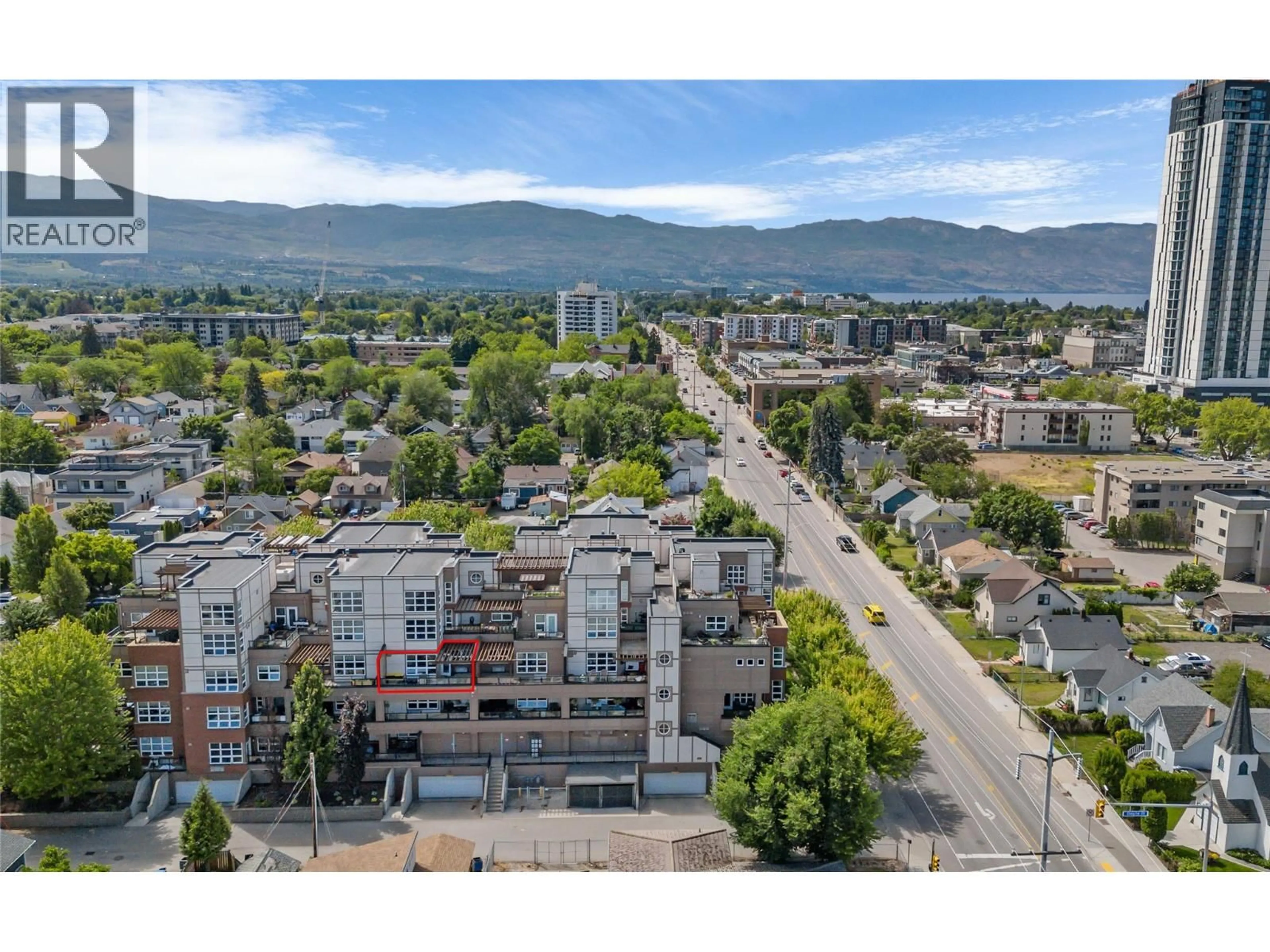 A pic from outside/outdoor area/front of a property/back of a property/a pic from drone, mountain view for 307 - 700 MARTIN AVENUE, Kelowna British Columbia V1Y6V3